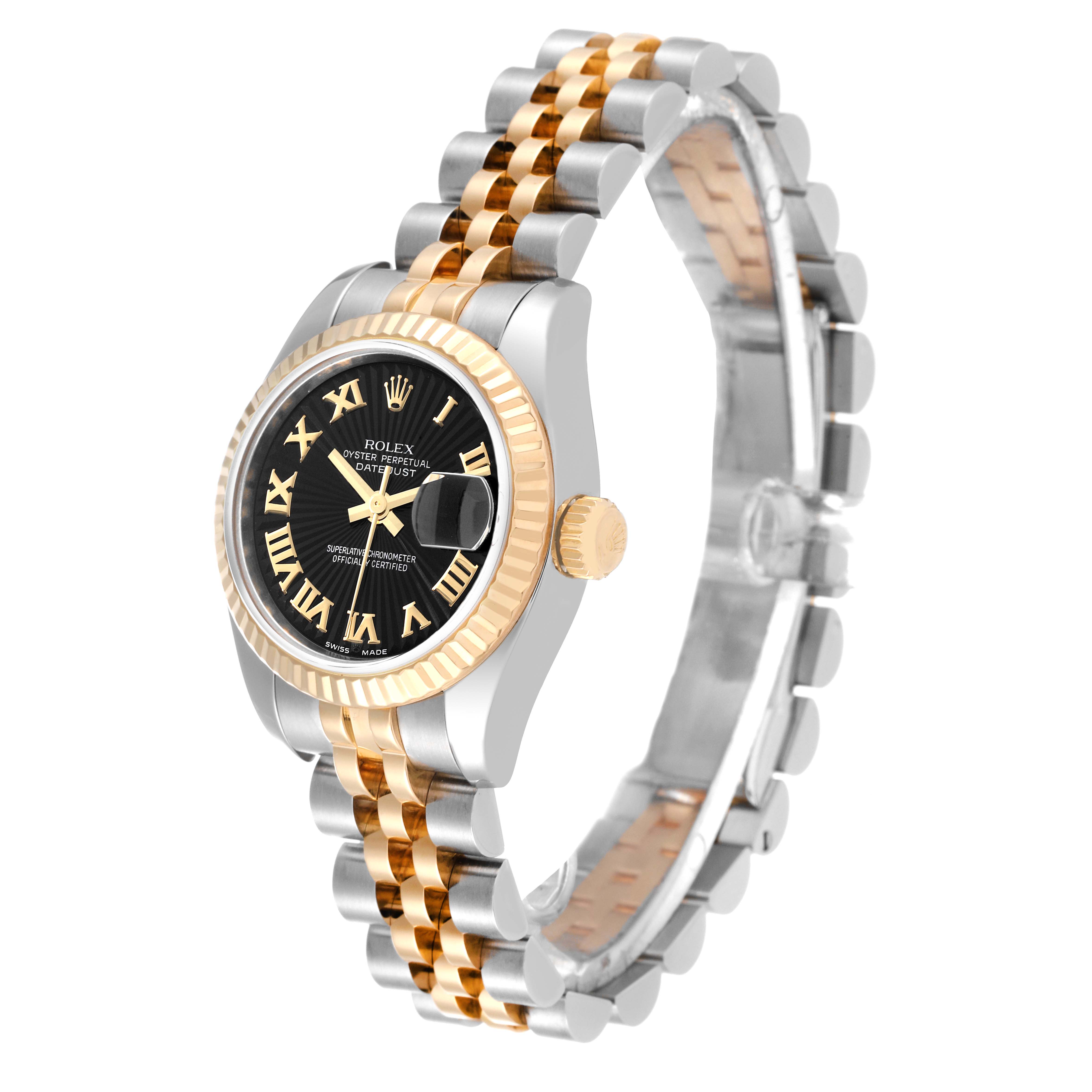 This image shows a Rolex Datejust 179173 Women's Steel and Gold (two tone) Black Dial 179173 Women's Steel and Gold (two tone) Black Dial watch at an angle displaying its black dial, fluted bezel, and two-tone bracelet.