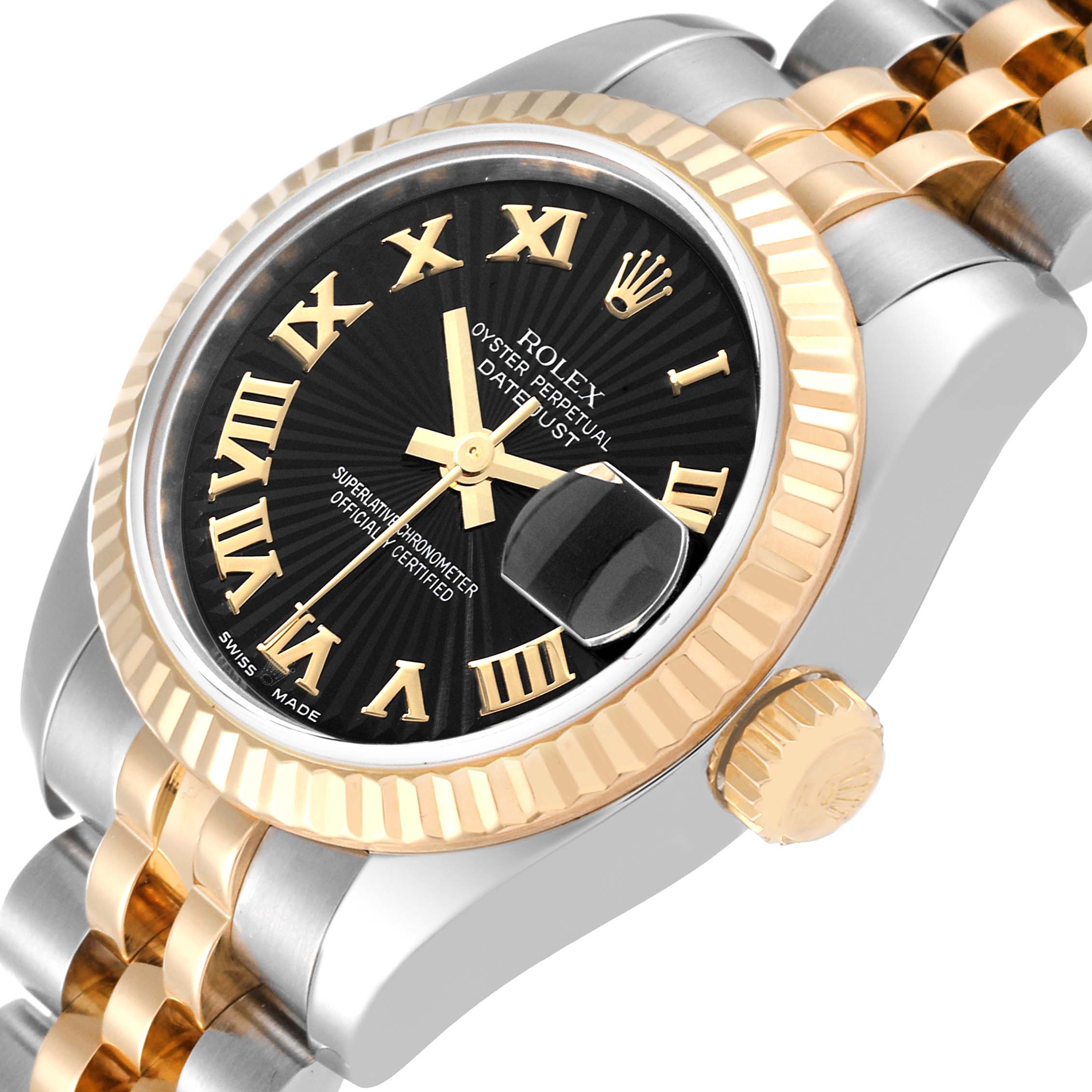 The image shows a close-up, angled view of a Rolex Datejust 179173 Women's Steel and Gold (two tone) Black Dial 179173 Women's Steel and Gold (two tone) Black Dial watch displaying the face, bezel, and part of the bracelet.