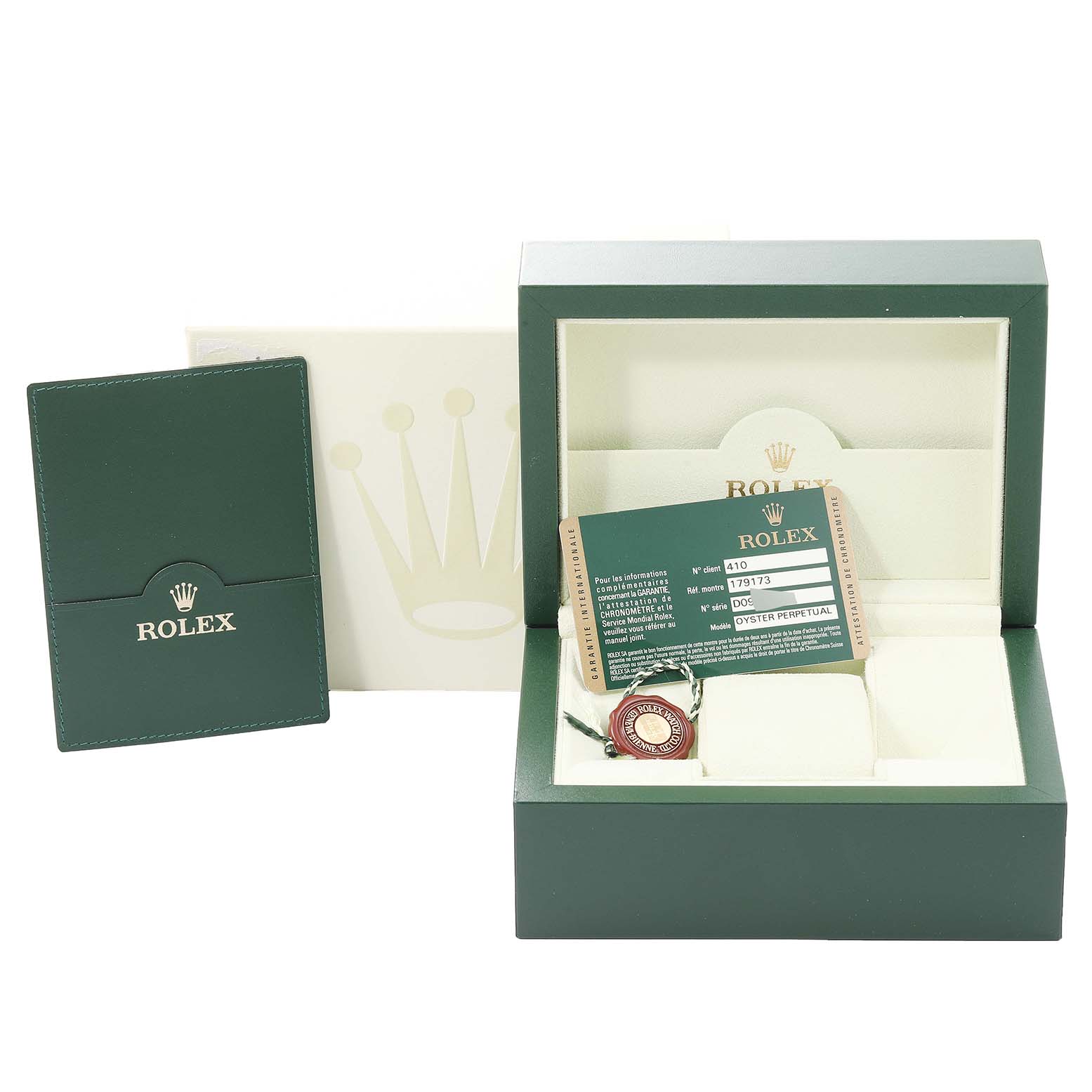 The image shows the packaging and accessories for a Rolex Datejust 179173 Women's Steel and Gold (two tone) Black Dial 179173 Women's Steel and Gold (two tone) Black Dial, including a box, warranty card, and booklet.
