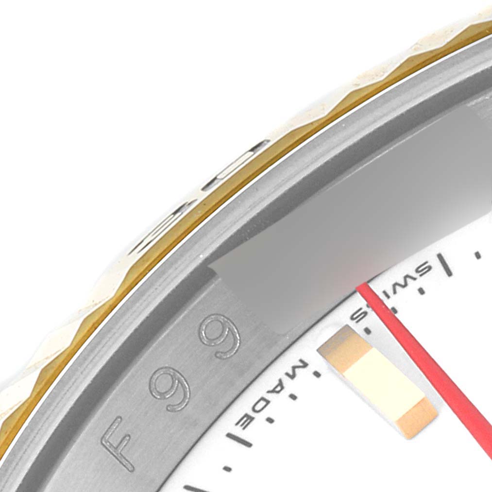 The image shows a close-up view of the bezel and part of the dial of a Rolex Turn-o-Graph 116263 Men's Steel and Gold (two tone) White Dial 116263 Men's Steel and Gold (two tone) White Dial watch, with visible markings and details.