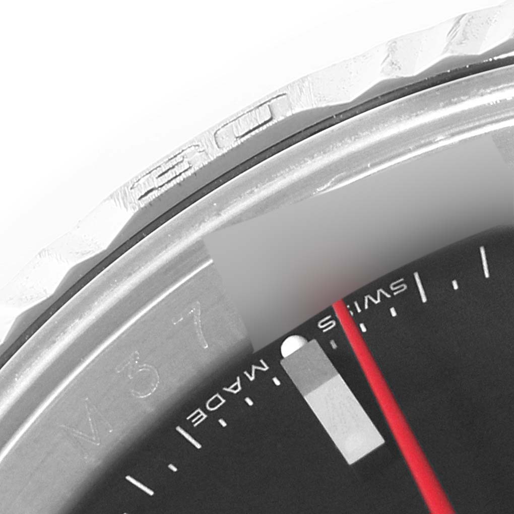 This close-up image of a Rolex Turn-o-Graph 116264 Men's Stainless Steel Black Dial 116264 Men's Stainless Steel Black Dial model shows part of the bezel, dial, and red seconds hand.