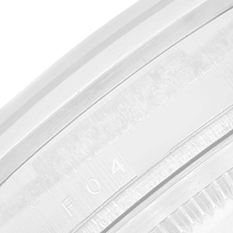 This close-up image shows the bezel and part of the case of a Rolex Explorer 114270 Men
s Stainless Steel Black Dial 114270 Men
s Stainless Steel Black Dial watch, highlighting the engraved details.