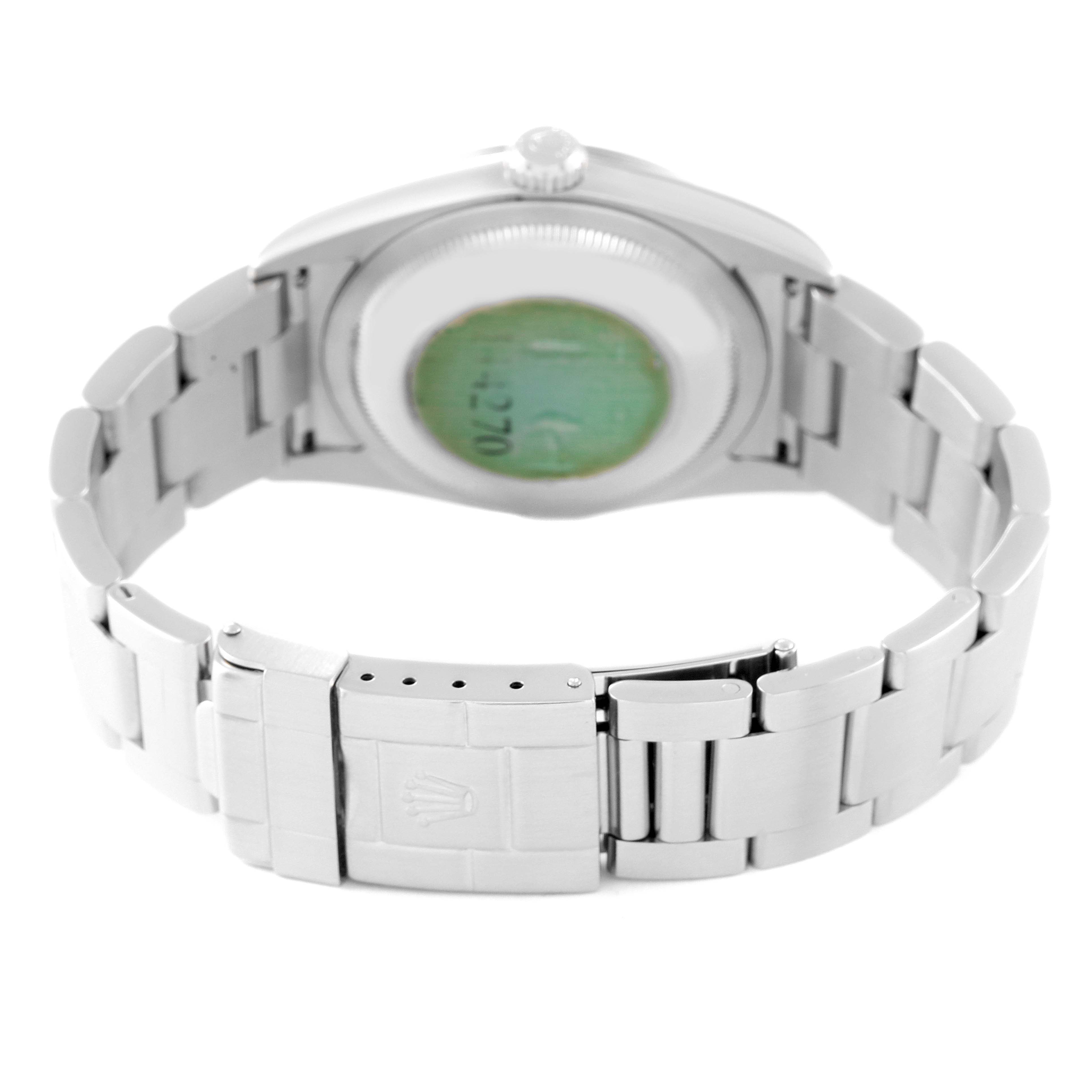 The image shows the back view of the Rolex Explorer 114270 Men
s Stainless Steel Black Dial 114270 Men
s Stainless Steel Black Dial model watch, highlighting the bracelet, clasp, and case back.