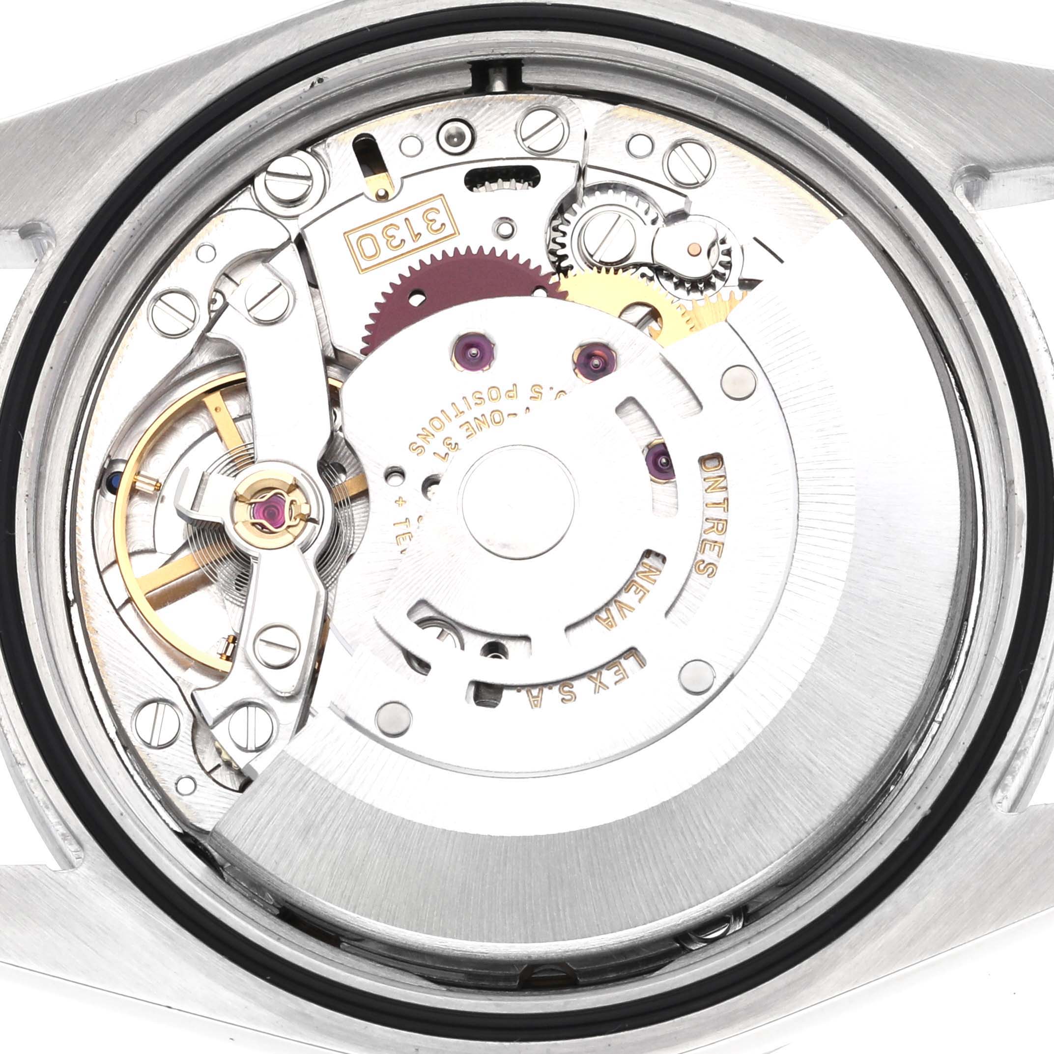 The image shows the movement of a Rolex Explorer 114270 Men's Stainless Steel Black Dial 114270 Men's Stainless Steel Black Dial watch from the back, highlighting gears and mechanisms.