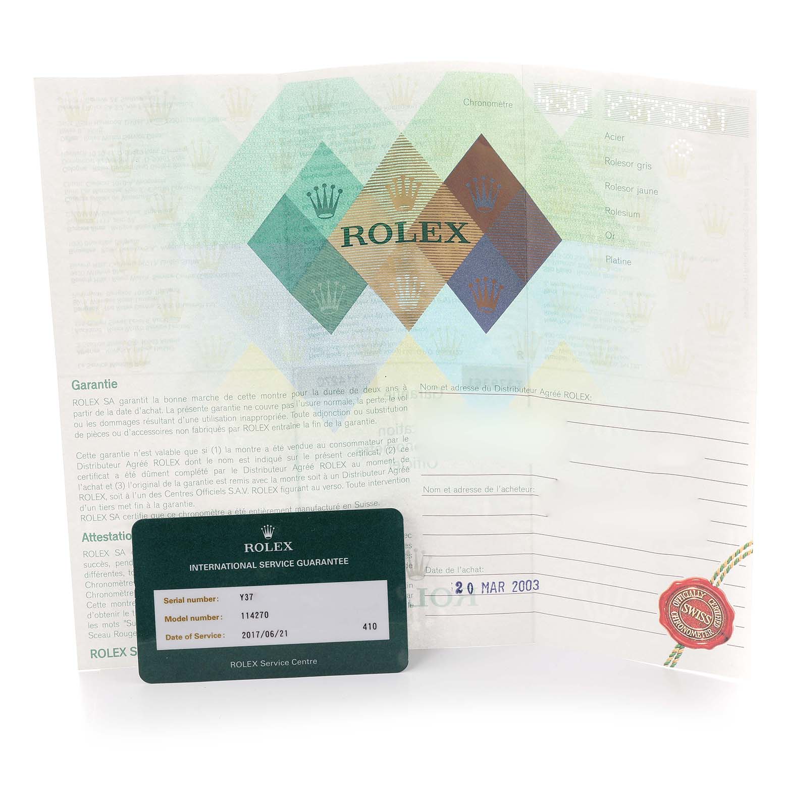 The image shows a Rolex Explorer 114270 Men
s Stainless Steel Black Dial 114270 Men
s Stainless Steel Black Dial model’s guarantee paperwork and an international service guarantee card.