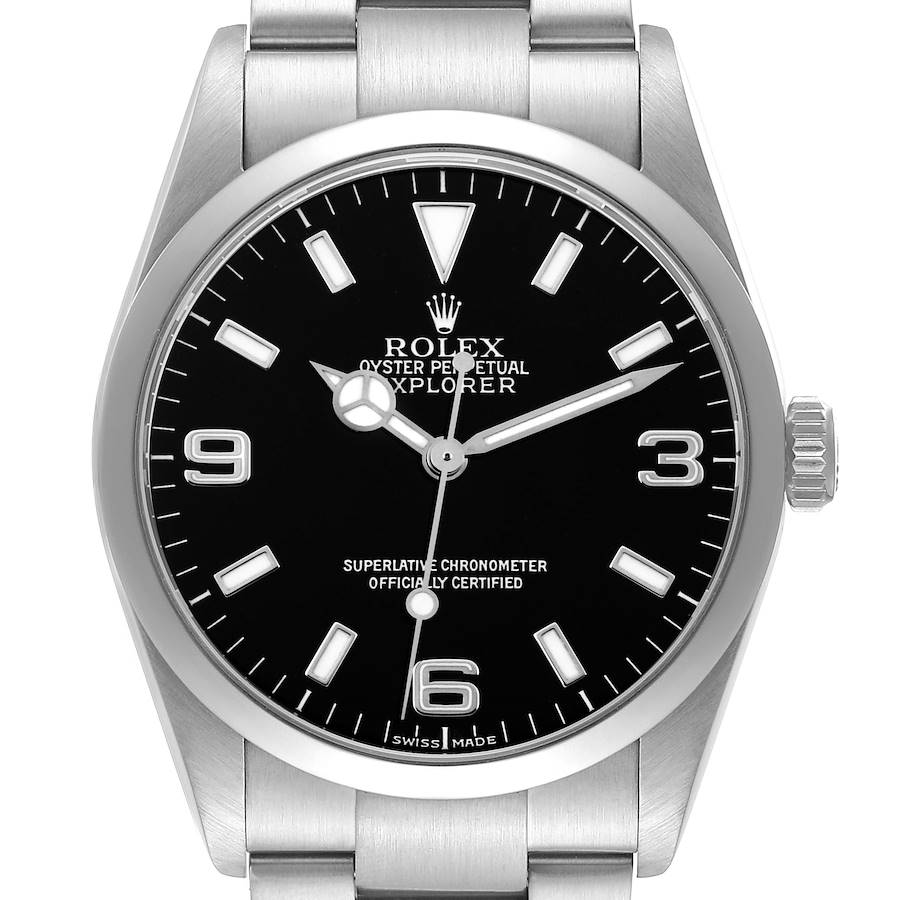 The Rolex Explorer watch is shown from the front, highlighting the dial, hour markers, hands, and part of the bracelet.