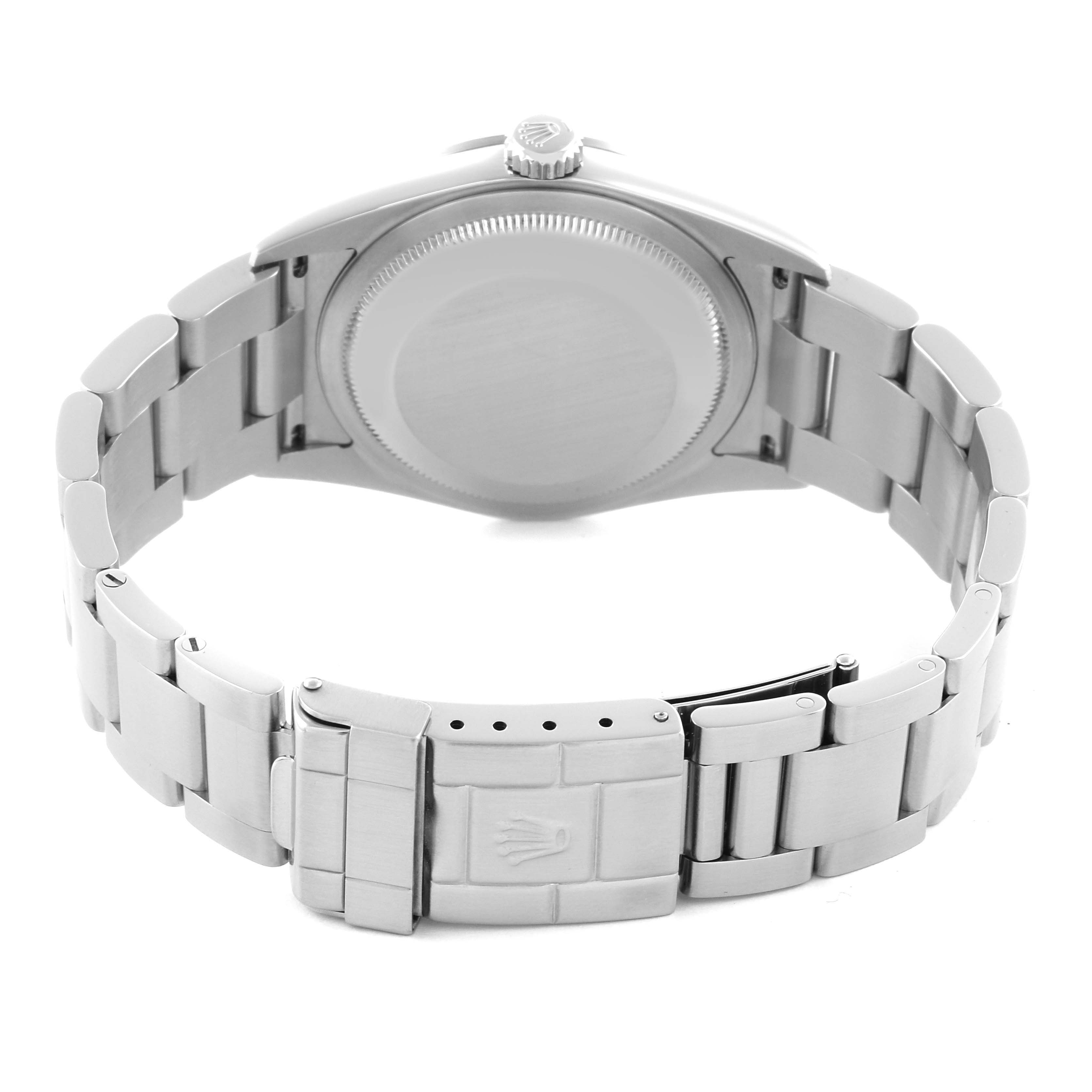 The image shows the back view of a Rolex Explorer 114270 Men
s Stainless Steel Black Dial 114270 Men
s Stainless Steel Black Dial watch, focusing on the case back and clasp of the bracelet.