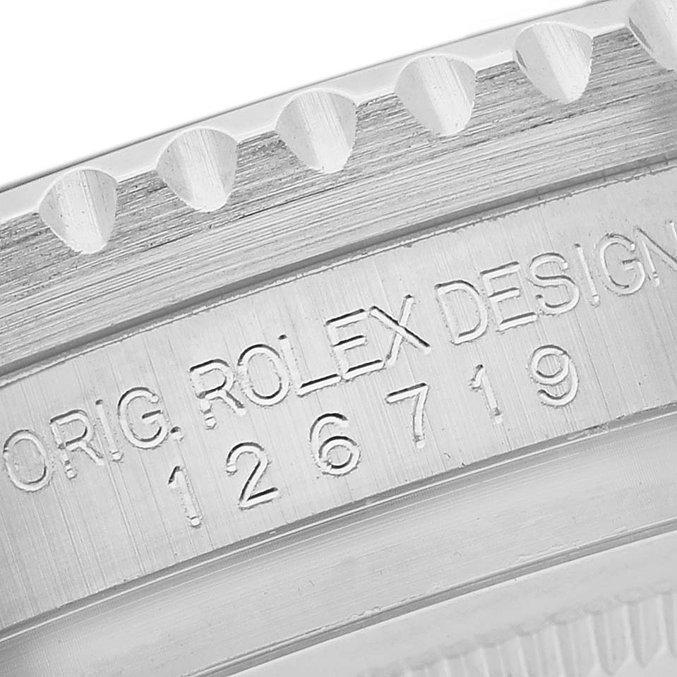 This image shows a close-up view of the case side and bezel of a Rolex GMT-Master 126719 Men's White Gold Blue Dial 126719 Men's White Gold Blue Dial, highlighting the engraved model number 126719.