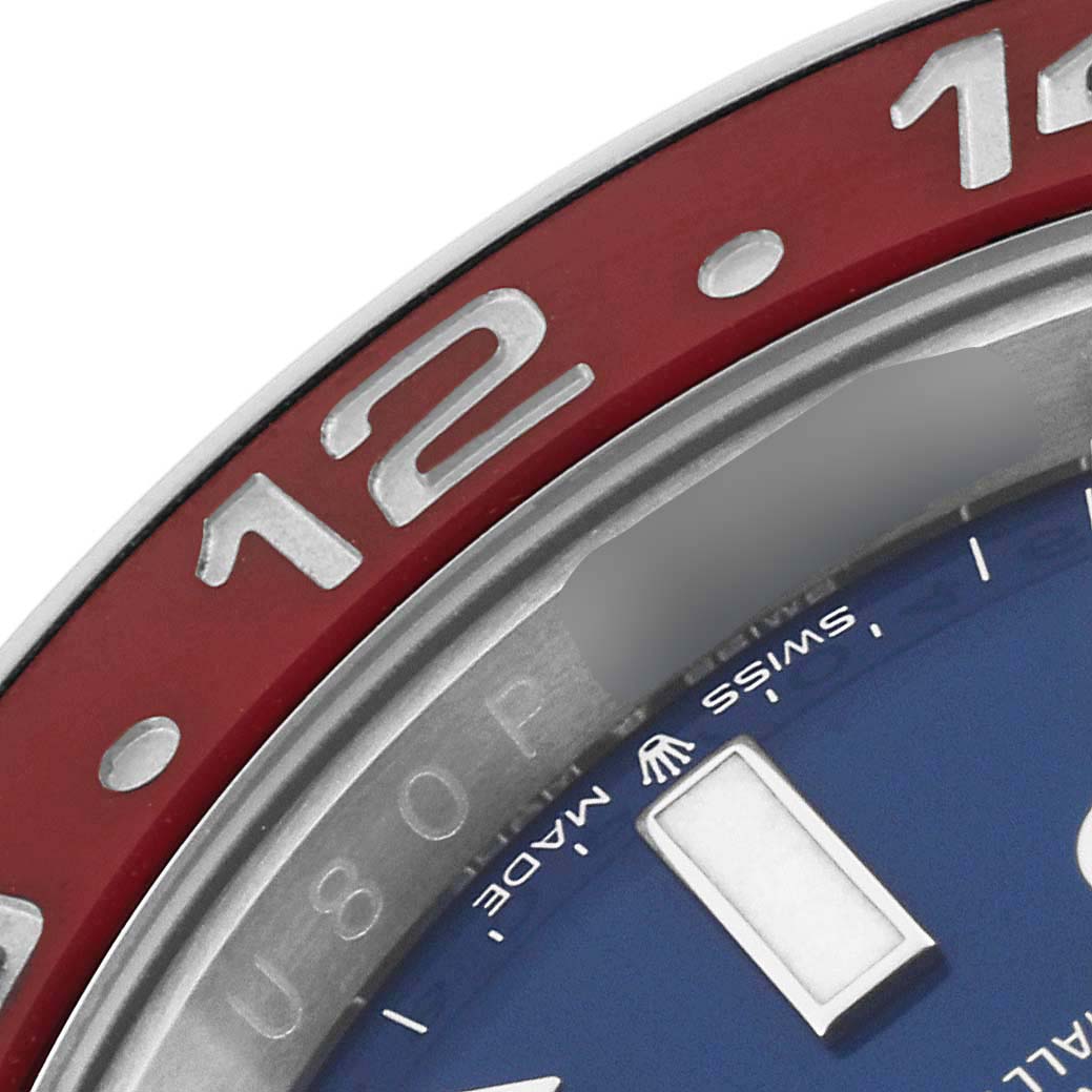 The image shows a close-up of the bezel and a portion of the dial of a Rolex GMT-Master 126719 Men's White Gold Blue Dial 126719 Men's White Gold Blue Dial watch.