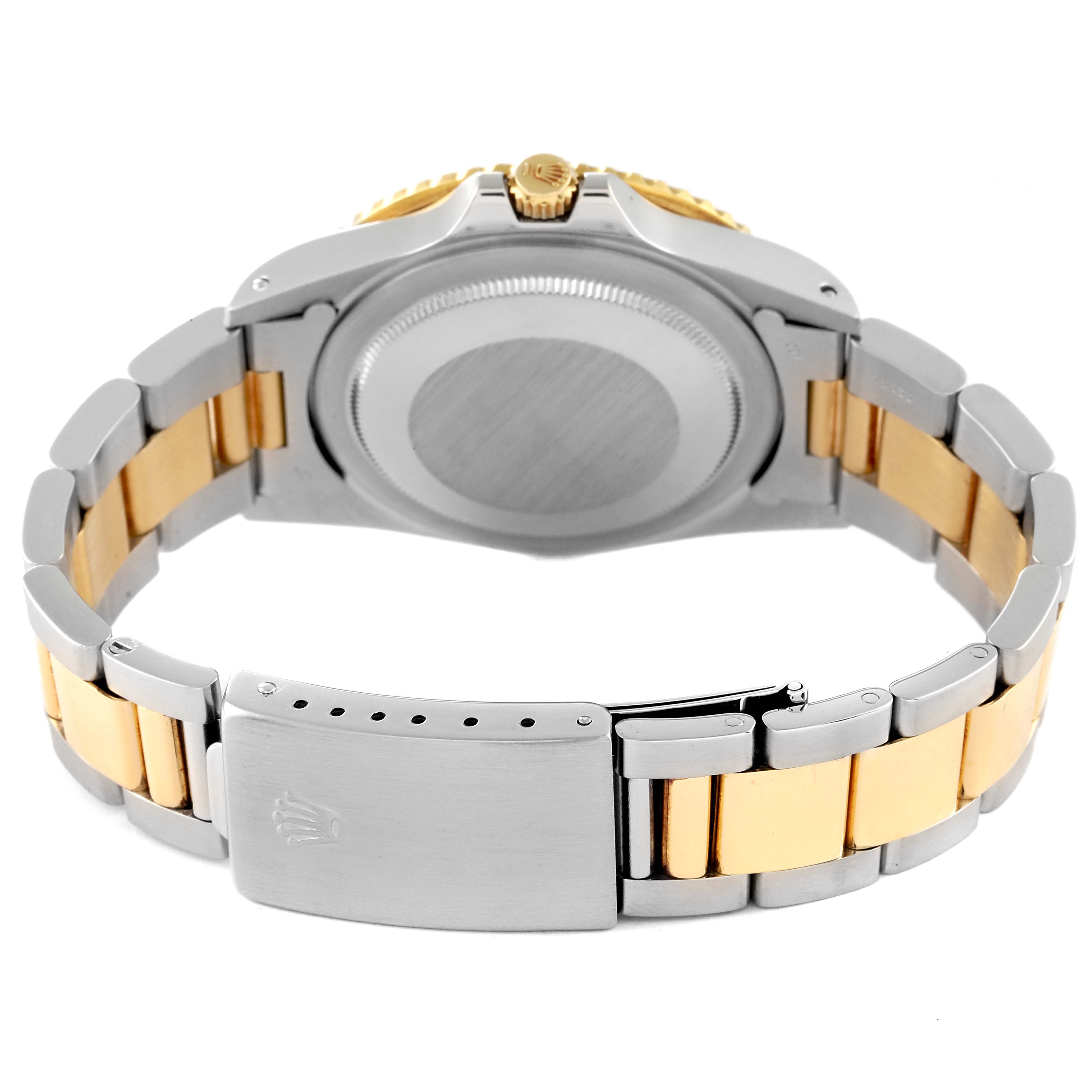 This image shows the back case and bracelet of a Rolex GMT-Master 16753 Men's Steel and Gold (two tone) Black Dial 16753 Men's Steel and Gold (two tone) Black Dial watch.