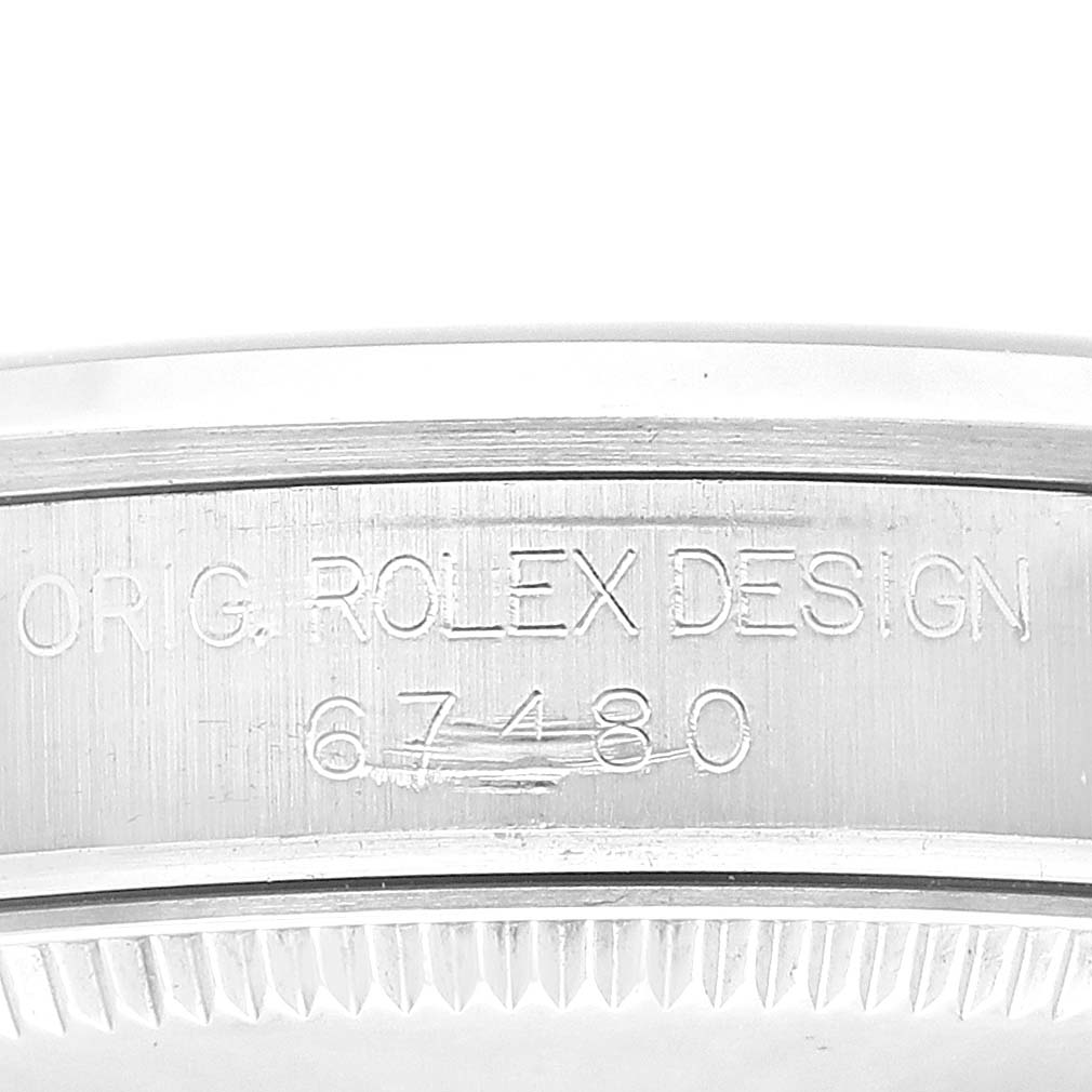 The image shows a close-up of the case side of a Mid-Size Rolex watch, highlighting the engraved model number 67480 and "ORIG. ROLEX DESIGN."