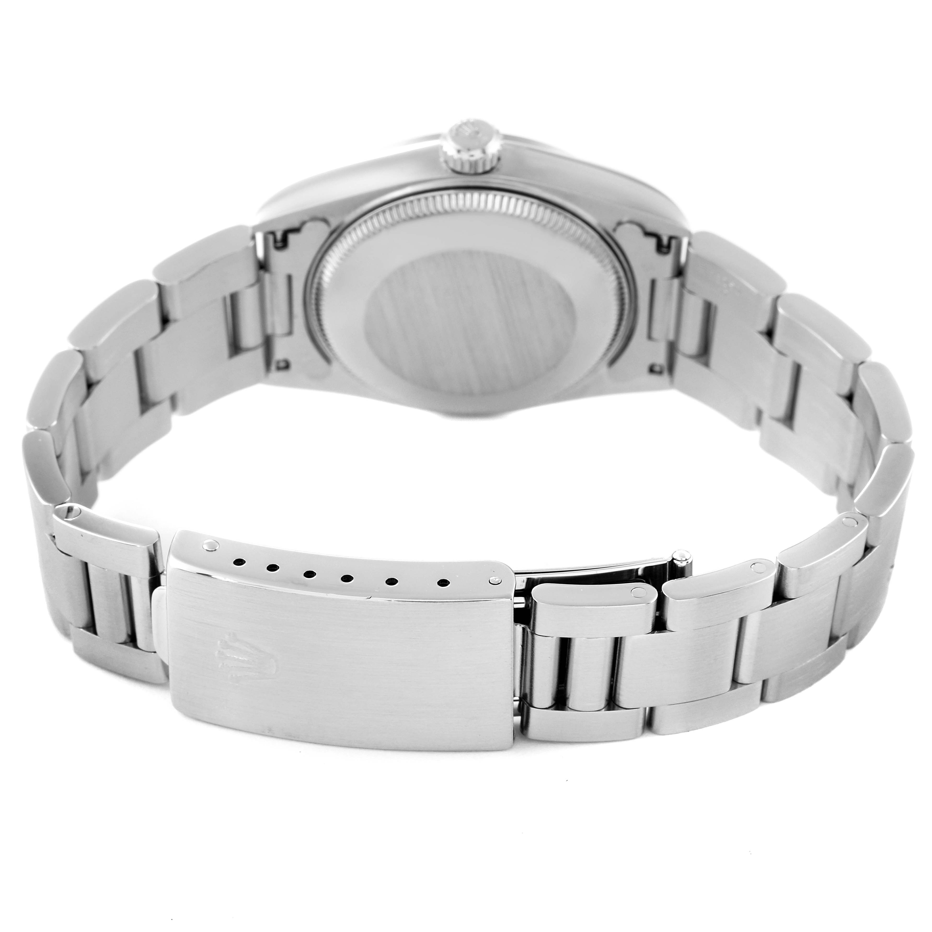 The image shows the back view of a Rolex Mid-Size 68240 Women
s Stainless Steel Blue Dial 68240 Women
s Stainless Steel Blue Dial watch featuring the clasp and bracelet links.