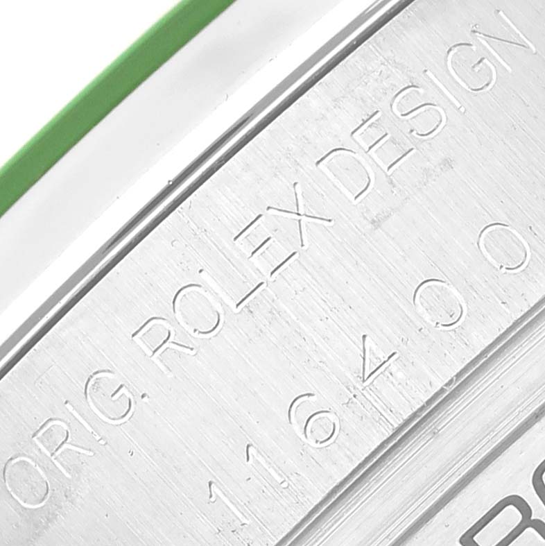 Close-up of the engraving on the side of the Rolex Milgauss 116400 Men's Stainless Steel Black Dial 116400 Men's Stainless Steel Black Dial watch case with the model number and "ROLEX DESIGN" text.