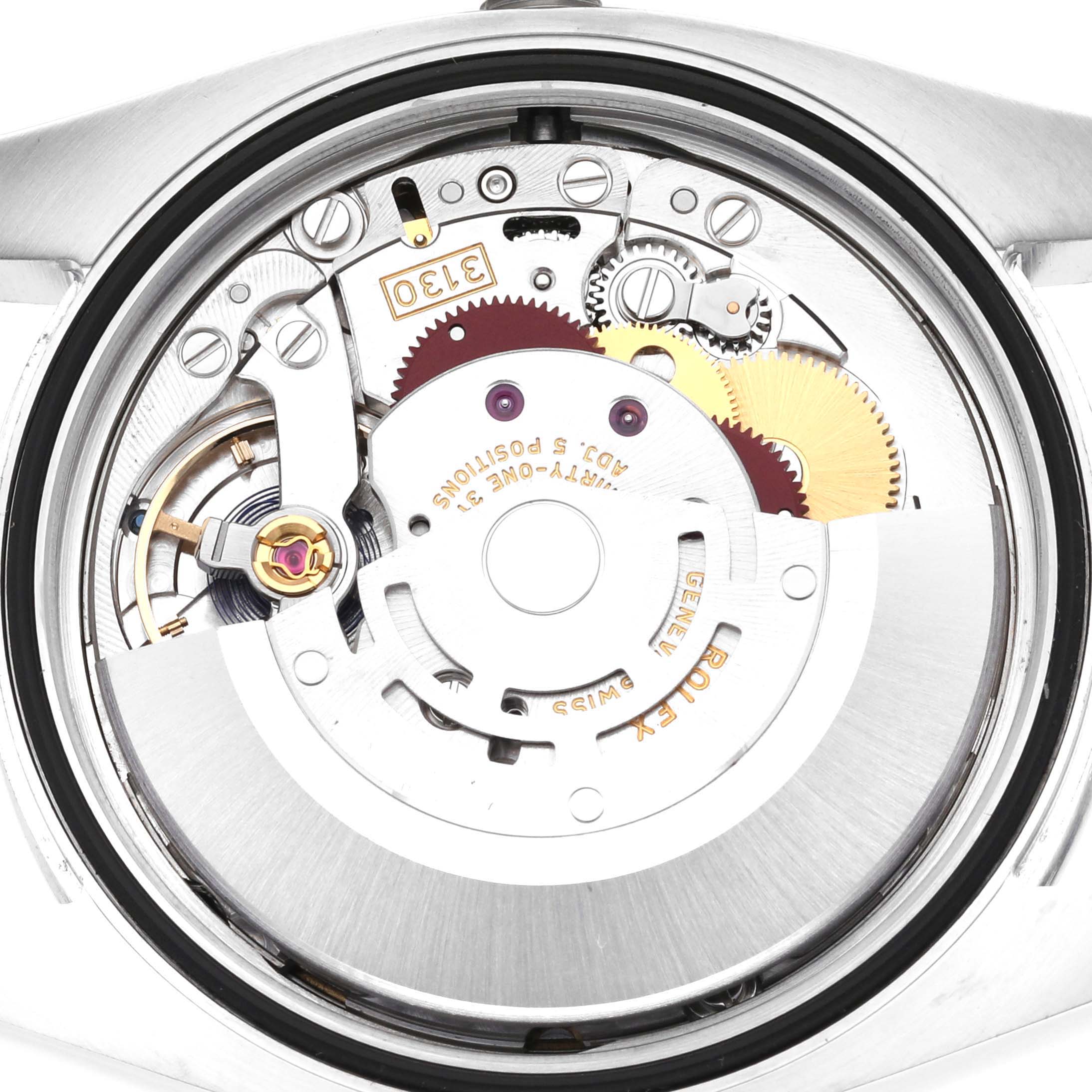 The image shows the movement mechanism of a Rolex Oyster Perpetual 116000 Men
s Stainless Steel Black Dial 116000 Men
s Stainless Steel Black Dial watch from a top-down angle.