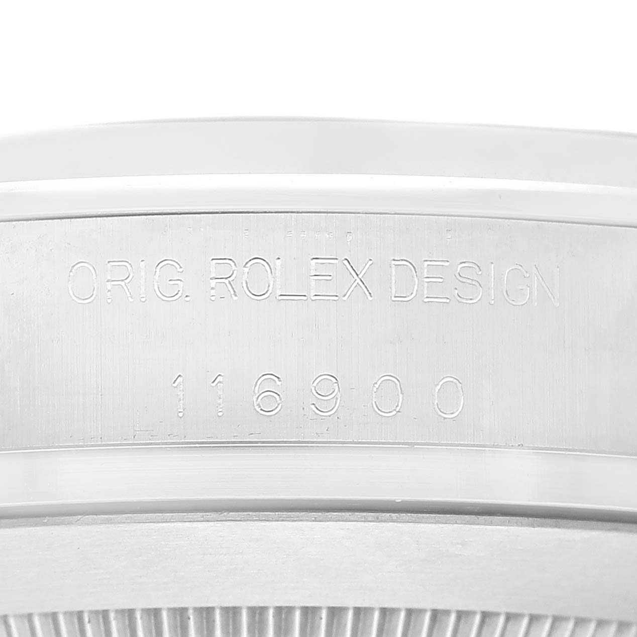 The image shows a close-up of the inner side of the bezel of a Rolex Air-King 116900 Men's Stainless Steel Black Dial 116900 Men's Stainless Steel Black Dial watch with the engraving "ORIG. ROLEX DESIGN 116900".