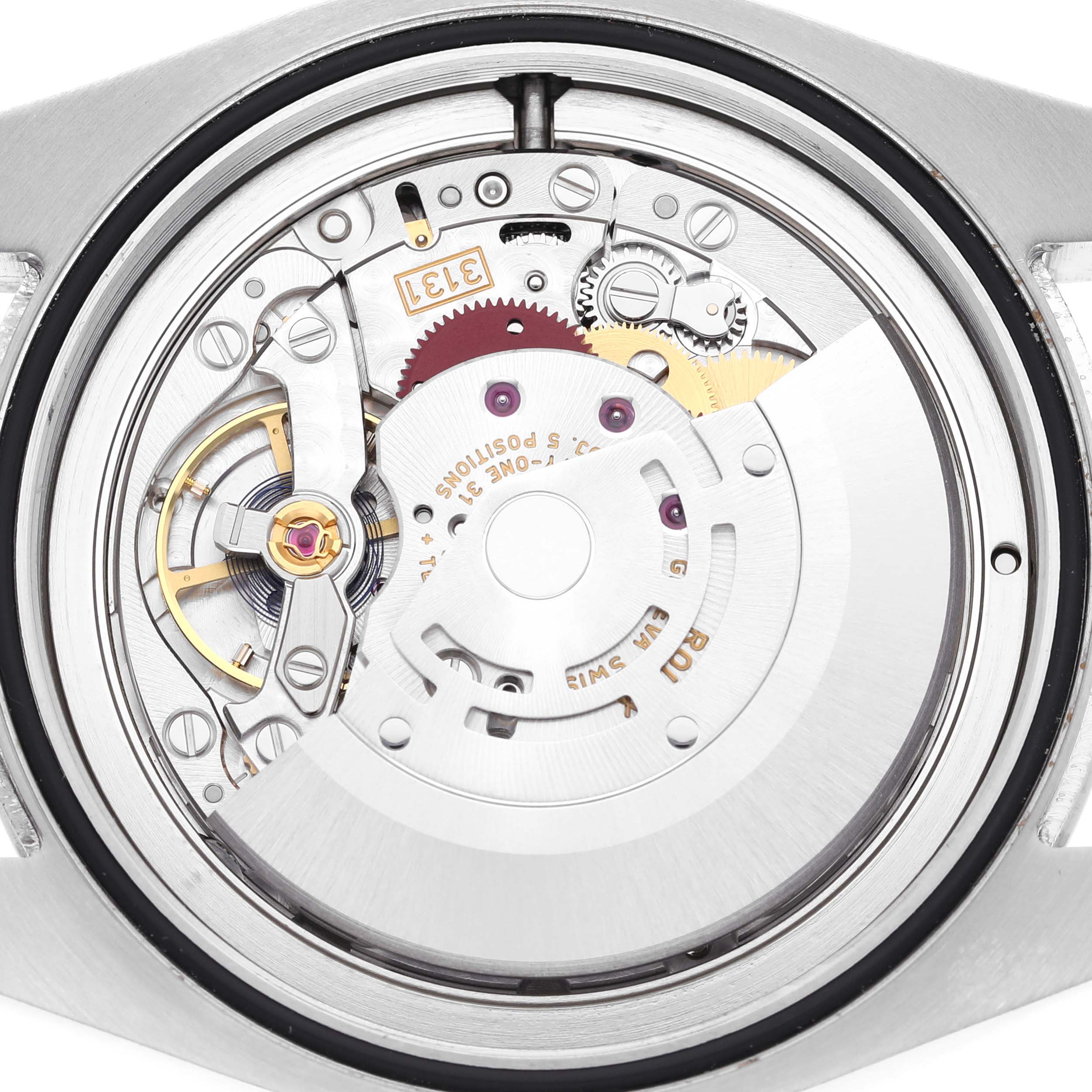 This image shows the movement and internal mechanical parts of a Rolex Air-King 116900 Men's Stainless Steel Black Dial 116900 Men's Stainless Steel Black Dial watch from a back angle.