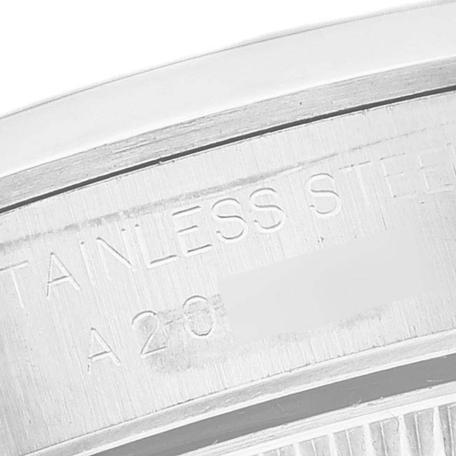 The image shows a close-up of the inner case back of a Rolex Oyster Perpetual 76080 Women's Stainless Steel Silver Dial 76080 Women's Stainless Steel Silver Dial watch, highlighting the "Stainless Steel" engraving.