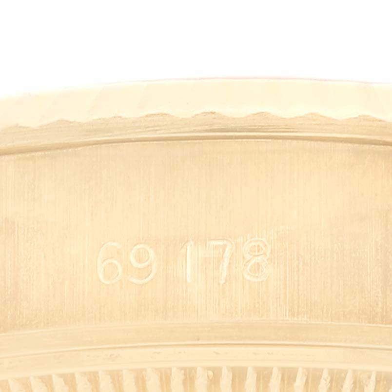 This image shows a close-up of the caseback edge of a Rolex President 69178 Women's Yellow Gold Champagne Dial 69178 Women's Yellow Gold Champagne Dial model watch, highlighting its model number.