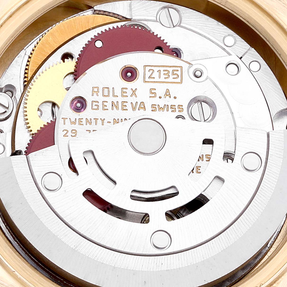 The image shows the internal mechanical movement of the Rolex President 69178 Women
s Yellow Gold Champagne Dial 69178 Women
s Yellow Gold Champagne Dial model watch, focusing on the gears and inscriptions.