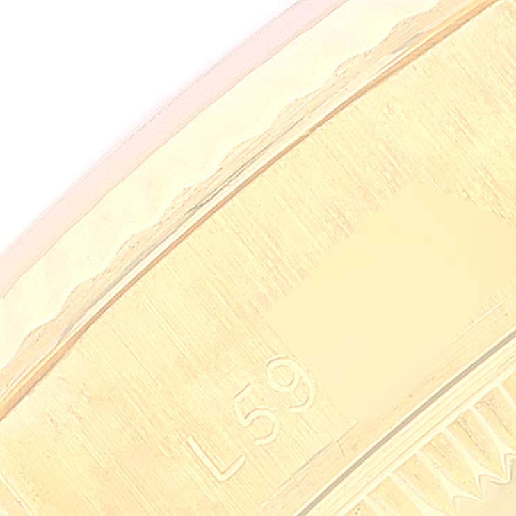 This image shows a close-up of the side of the Rolex President 69178 Women
s Yellow Gold Champagne Dial 69178 Women
s Yellow Gold Champagne Dial model watch, highlighting the engraving.
