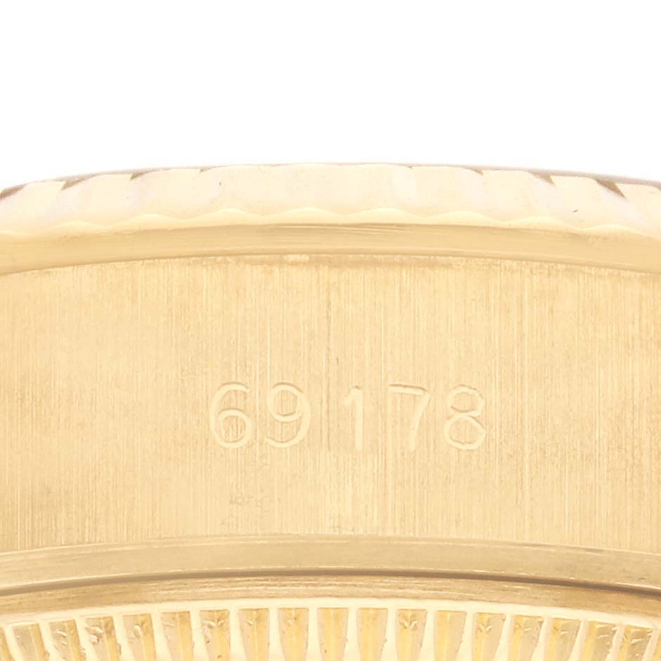 The image shows a close-up of the Rolex President 69178 Women's Yellow Gold Champagne Dial 69178 Women's Yellow Gold Champagne Dial watch model 69178, highlighting the side with the model number engraved.