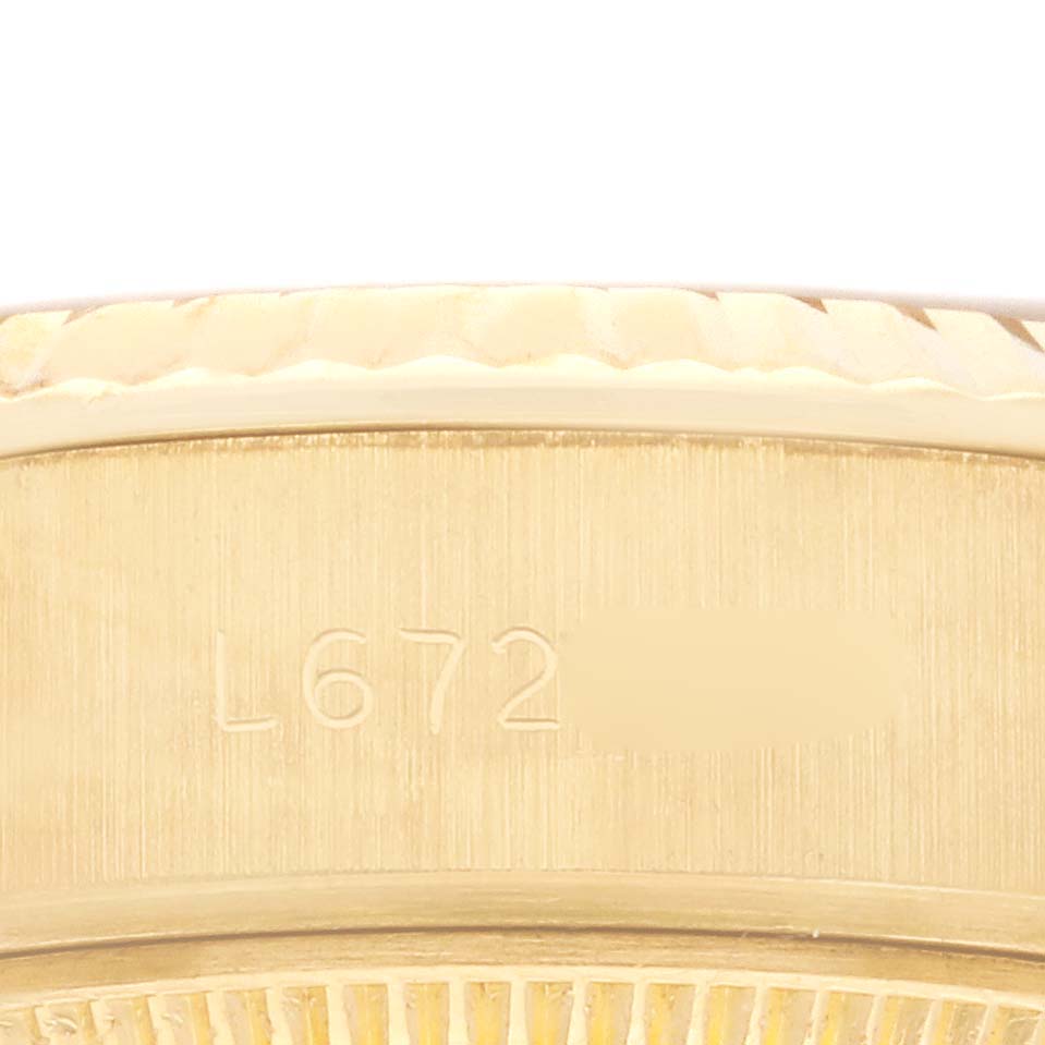 This close-up shows the side view of the Rolex President 69178 Women's Yellow Gold Champagne Dial 69178 Women's Yellow Gold Champagne Dial model, focusing on the case with the serial number visible.