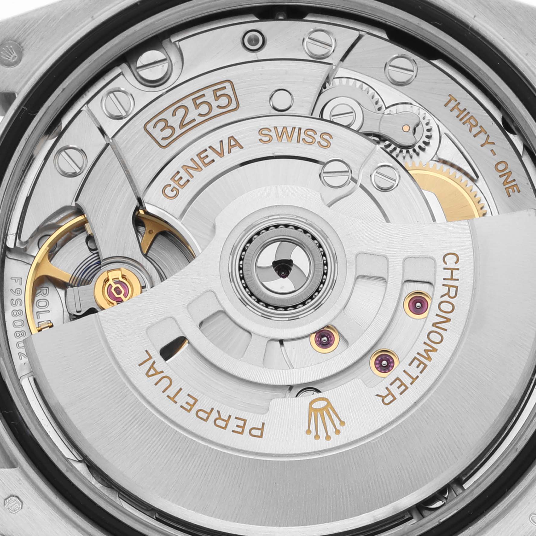 This close-up image shows the movement of a Rolex President 128349 Men's White Gold Mother of Pearl Dial 128349 Men's White Gold Mother of Pearl Dial model, highlighting the intricate gears and engravings.