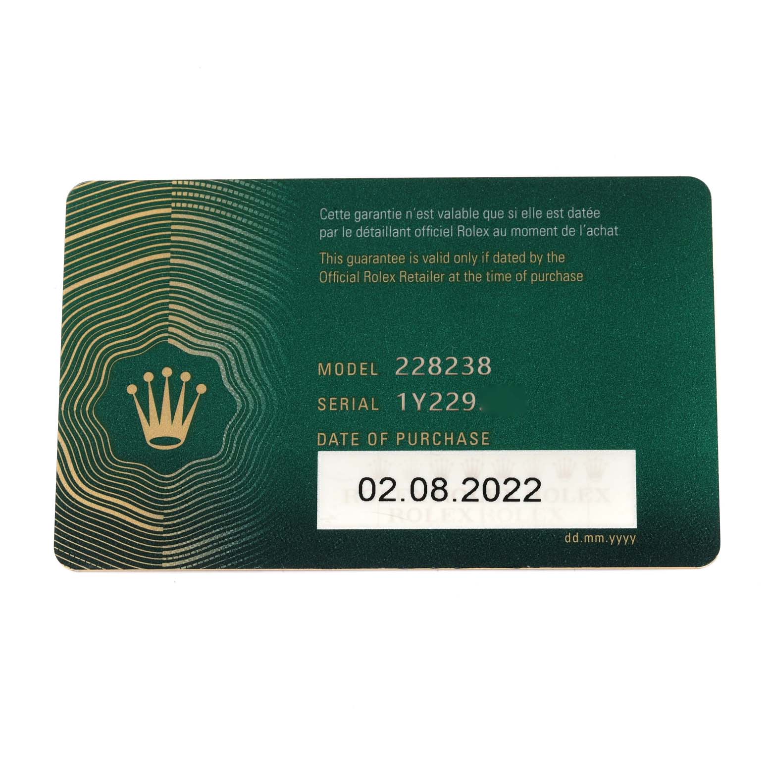 This image shows a warranty card for the Rolex President 228238 Men
s Yellow Gold Silver Dial 228238 Men
s Yellow Gold Silver Dial model 228238, detailing the serial number and date of purchase.