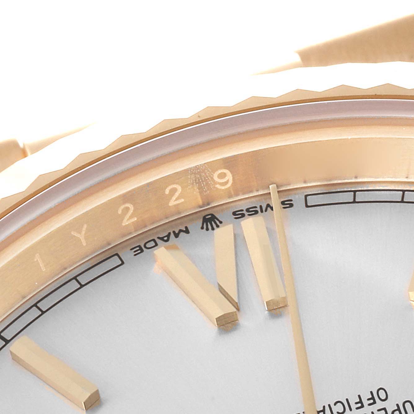 This close-up image shows the bezel, dial, and part of the hour markers of a Rolex President 228238 Men
s Yellow Gold Silver Dial 228238 Men
s Yellow Gold Silver Dial model watch.