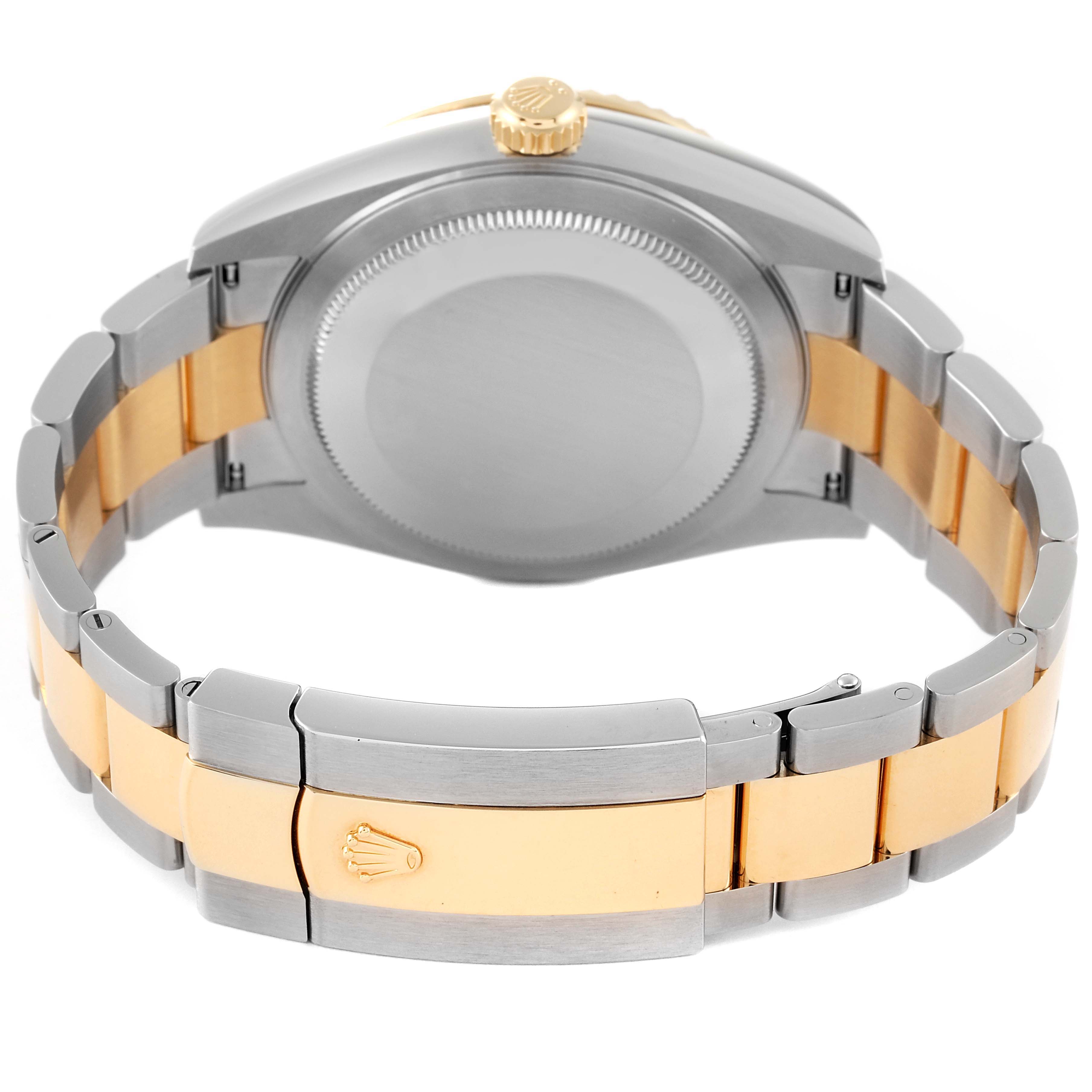 The image shows the back of a Rolex Sky-Dweller 326933 Men's Steel and Gold (two tone) Black Dial 326933 Men's Steel and Gold (two tone) Black Dial watch, highlighting its two-tone bracelet and the closed clasp with the Rolex logo.