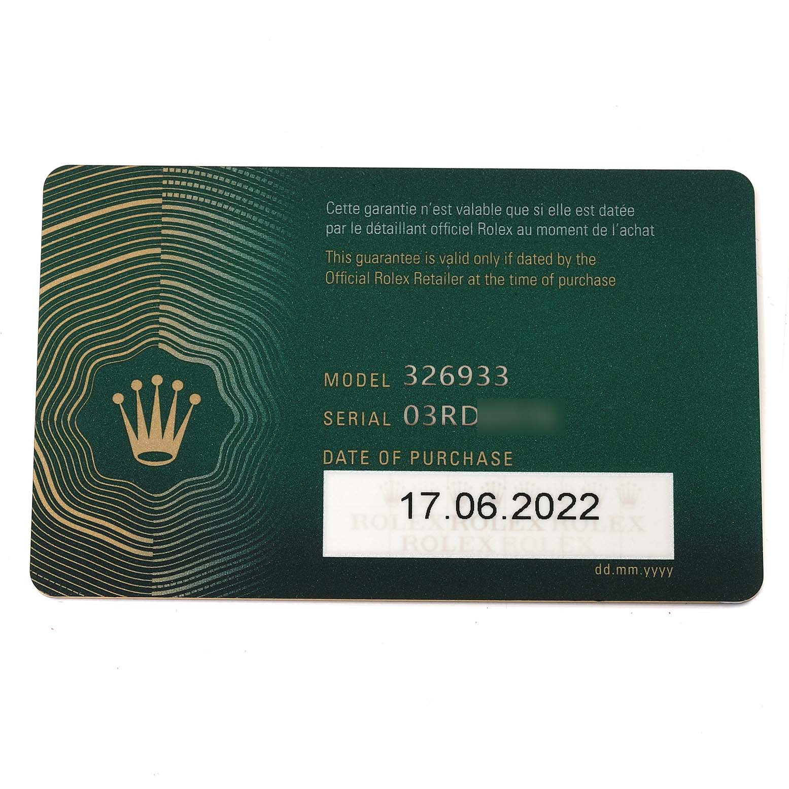 The image shows a close-up of a green guarantee card for a Rolex Sky-Dweller 326933 Men's Steel and Gold (two tone) Black Dial 326933 Men's Steel and Gold (two tone) Black Dial model 326933, dated June 17, 2022.