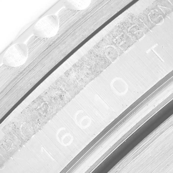 This close-up image shows the engraved details on the case of a Rolex Submariner 16610 Men's Stainless Steel Black Dial 16610 Men's Stainless Steel Black Dial watch.