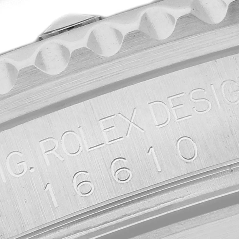 The image shows a close-up of the bezel and side engraving on the Rolex Submariner 16610 Men
s Stainless Steel Black Dial 16610 Men
s Stainless Steel Black Dial.