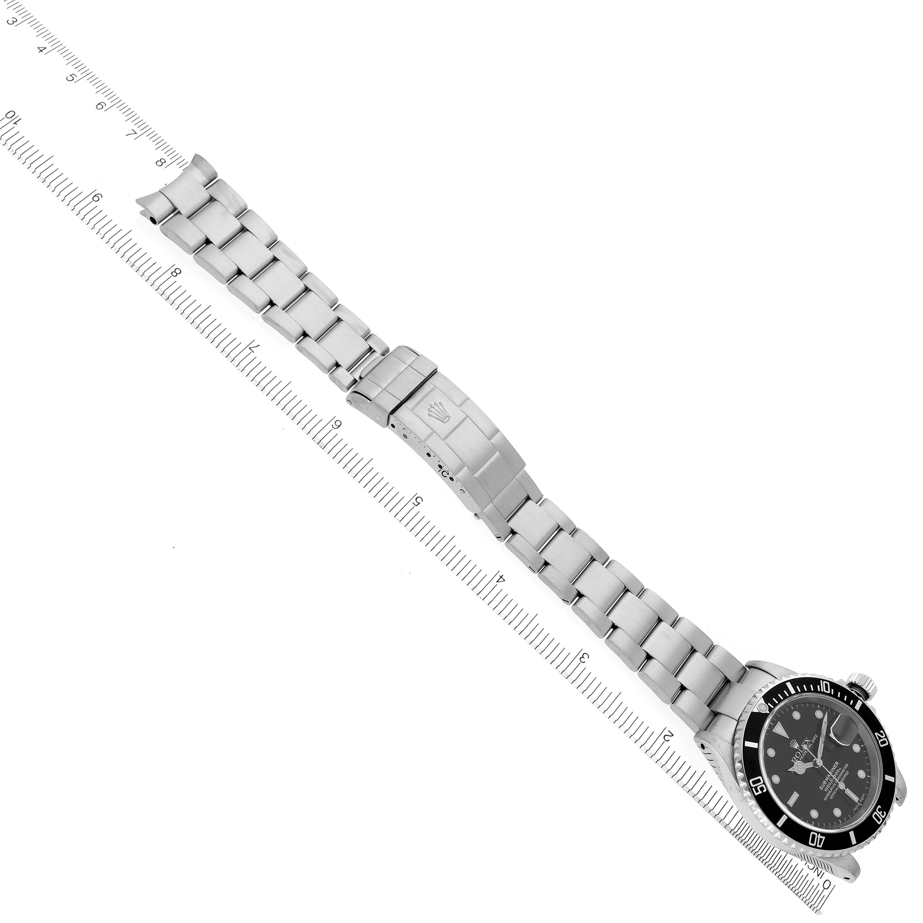 The Rolex Submariner 16610 Men
s Stainless Steel Black Dial 16610 Men
s Stainless Steel Black Dial watch is displayed diagonally with the dial, bezel, bracelet, and clasp visible.