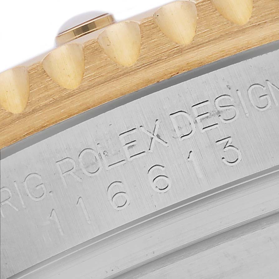 This image shows the engraved side view of a Rolex Submariner 116613 Men's Steel and Gold (two tone) Black Dial 116613 Men's Steel and Gold (two tone) Black Dial bezel and case.