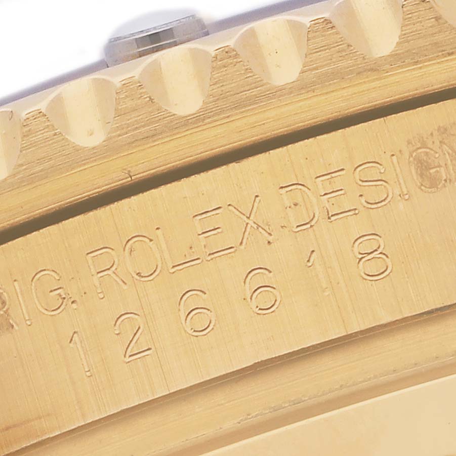 The image shows a close-up of the engraving on the side of a Rolex Submariner 126618LB Men's Yellow Gold Blue Dial 126618LB Men's Yellow Gold Blue Dial watch bezel and case.