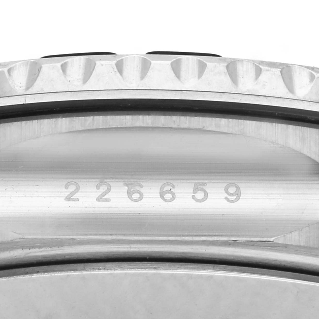 The image shows a side view of the Rolex Yacht-Master 226659 Men's White Gold Black Dial 226659 Men's White Gold Black Dial, highlighting the case with the serial number engraved.