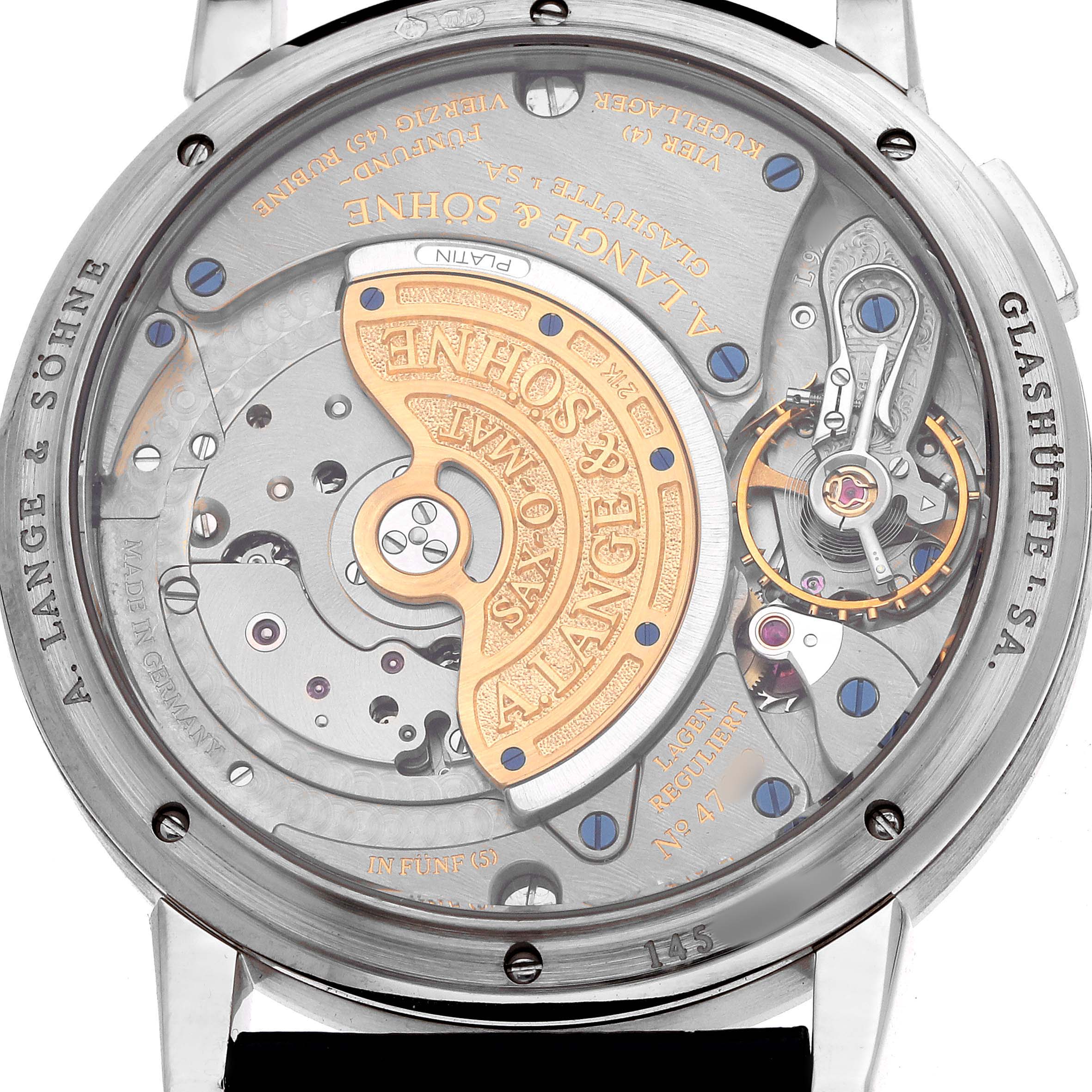 The image shows the movement of the Glashütte Original watch, focusing on the intricate mechanism and engraved details from the back.