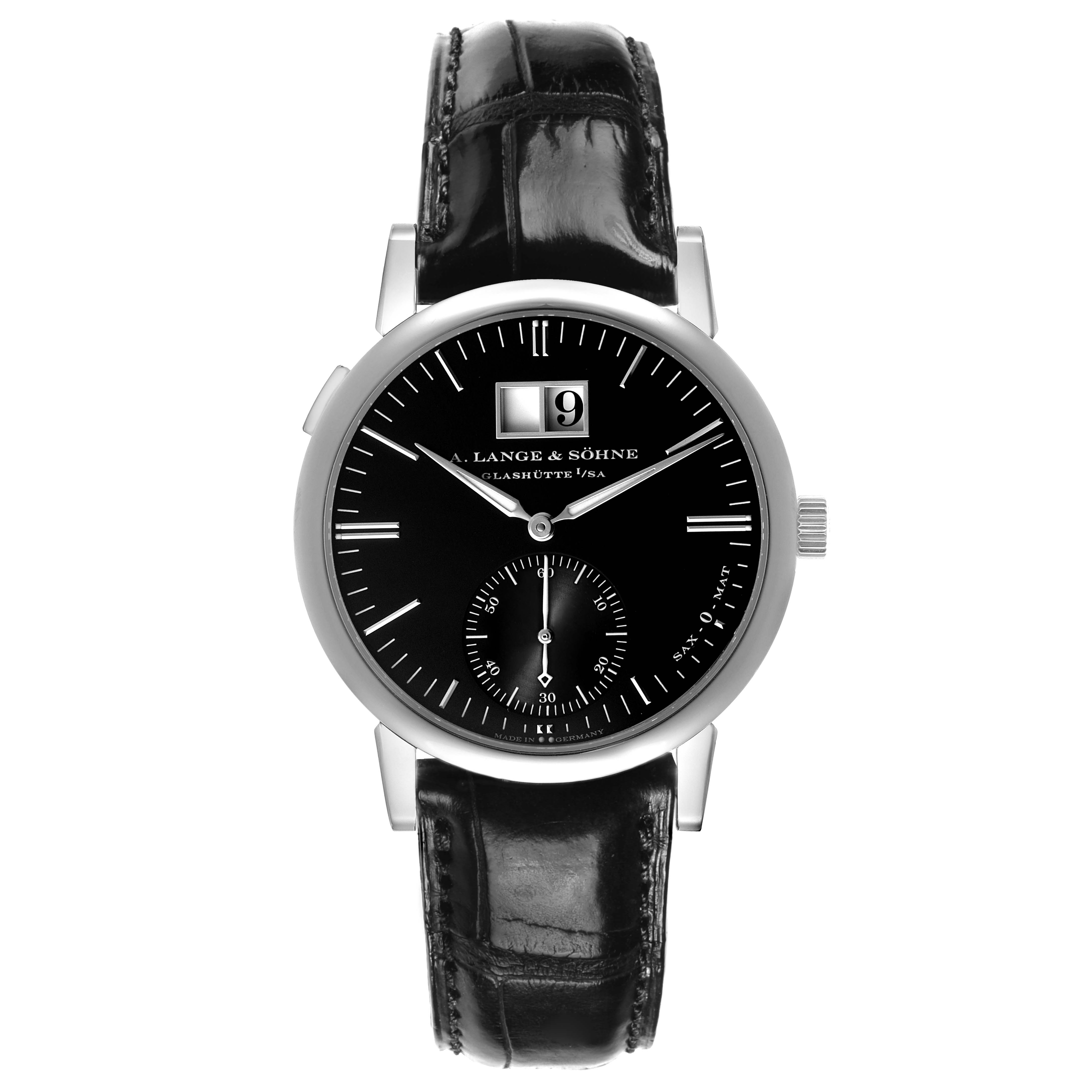 The Glashütte Original model is shown from a front view, showcasing its black dial, leather strap, and silver bezel.