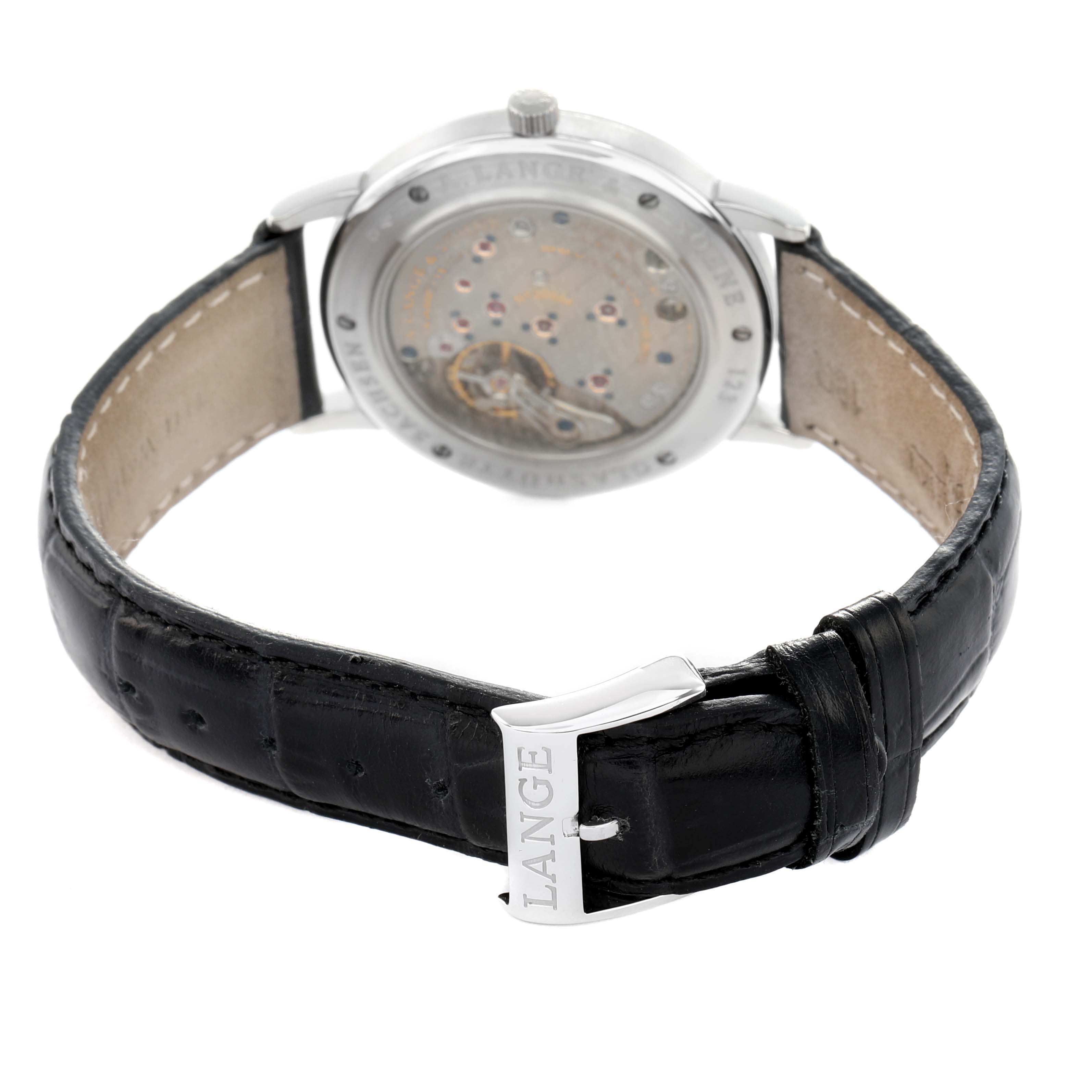 The image shows the back view of an A. Lange & Sohne 1815 221.025 Men's Platinum Silver Dial watch, highlighting the movement and buckle.