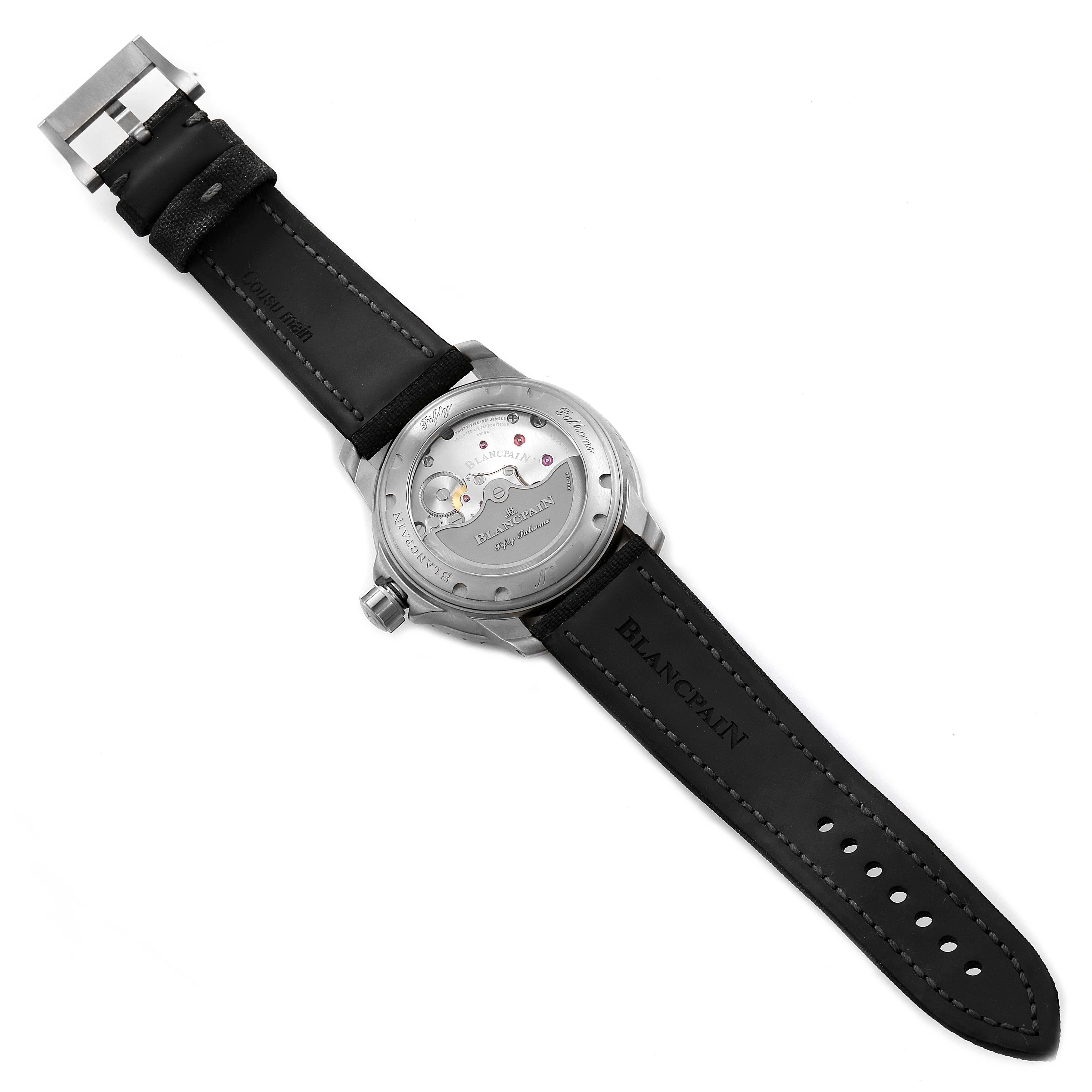 The image shows the back view of a Blancpain Fifty Fathoms 5015-12B30 Men's Titanium Black Dial 5015-12B30 Men's Titanium Black Dial watch, displaying its transparent case back and black strap.