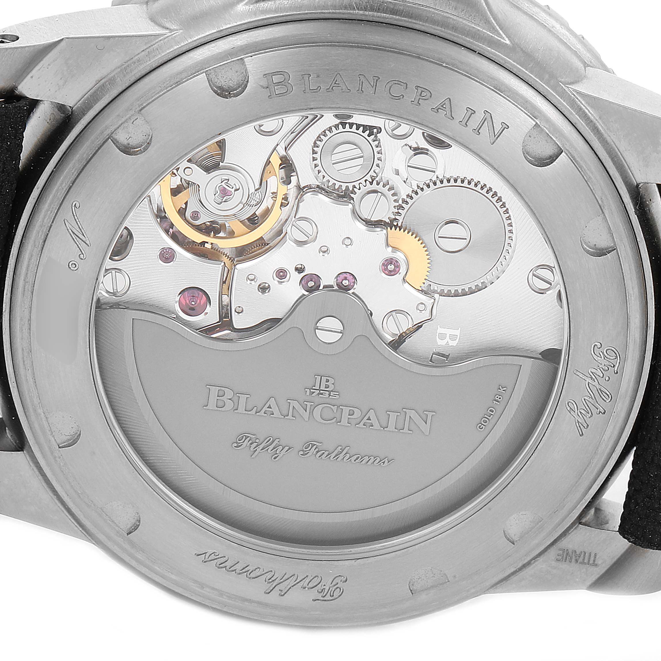 The image shows the back view of the Blancpain Fifty Fathoms 5015-12B30 Men's Titanium Black Dial 5015-12B30 Men's Titanium Black Dial watch, highlighting the intricate internal mechanisms and branding.