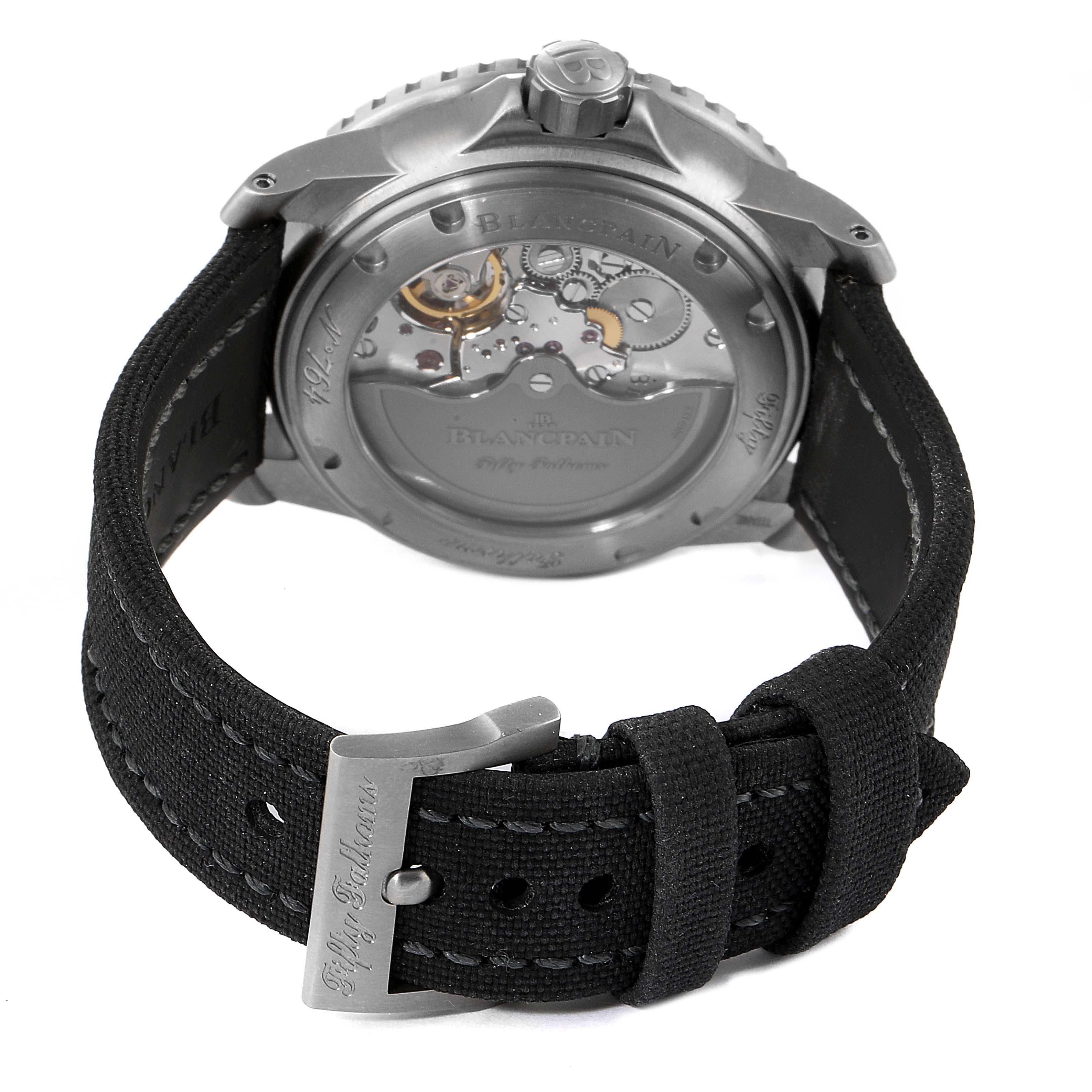 The image shows the rear view of the Blancpain Fifty Fathoms 5015-12B30 Men's Titanium Black Dial 5015-12B30 Men's Titanium Black Dial watch, highlighting the transparent case back and black strap.