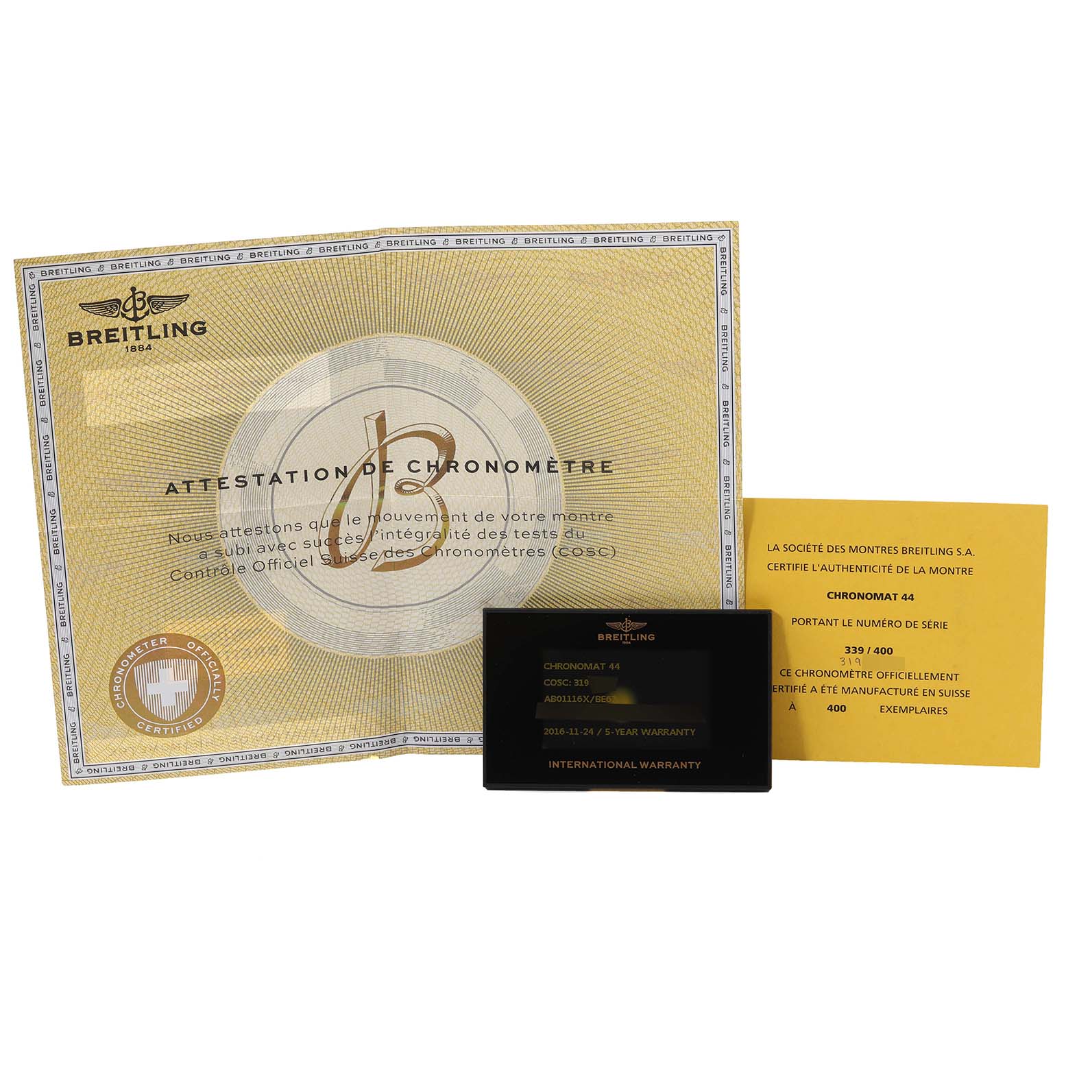 The image shows the warranty card, certification, and booklet for a Breitling Chronomat AB01116X/BE67 Men's Stainless Steel Mother of Pearl Dial AB01116X/BE67 Men's Stainless Steel Mother of Pearl Dial watch.