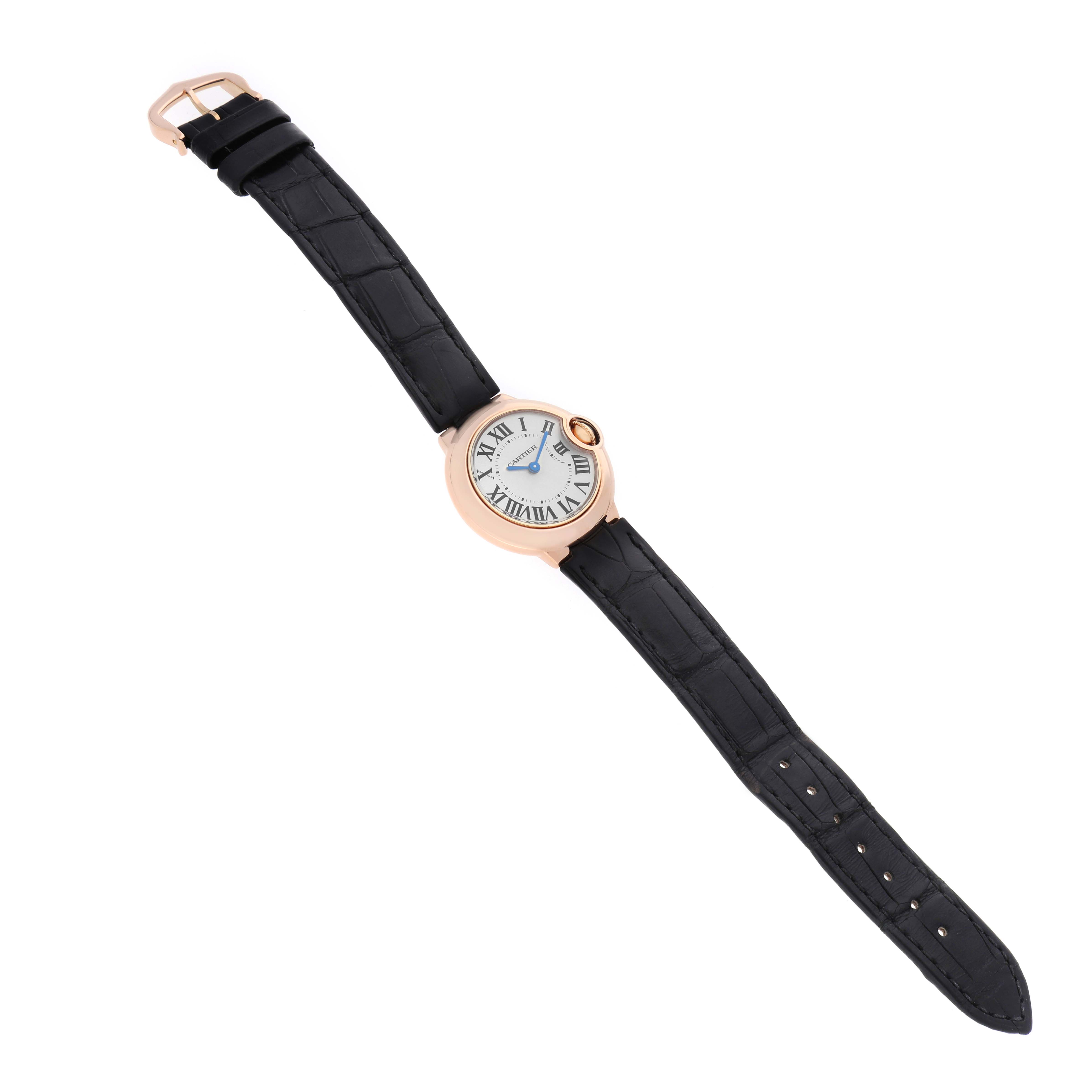The Cartier Ballon Bleu WGBB0007 Women's Rose Gold Silver Dial watch is shown from a top view, displaying the face, strap, and gold case.