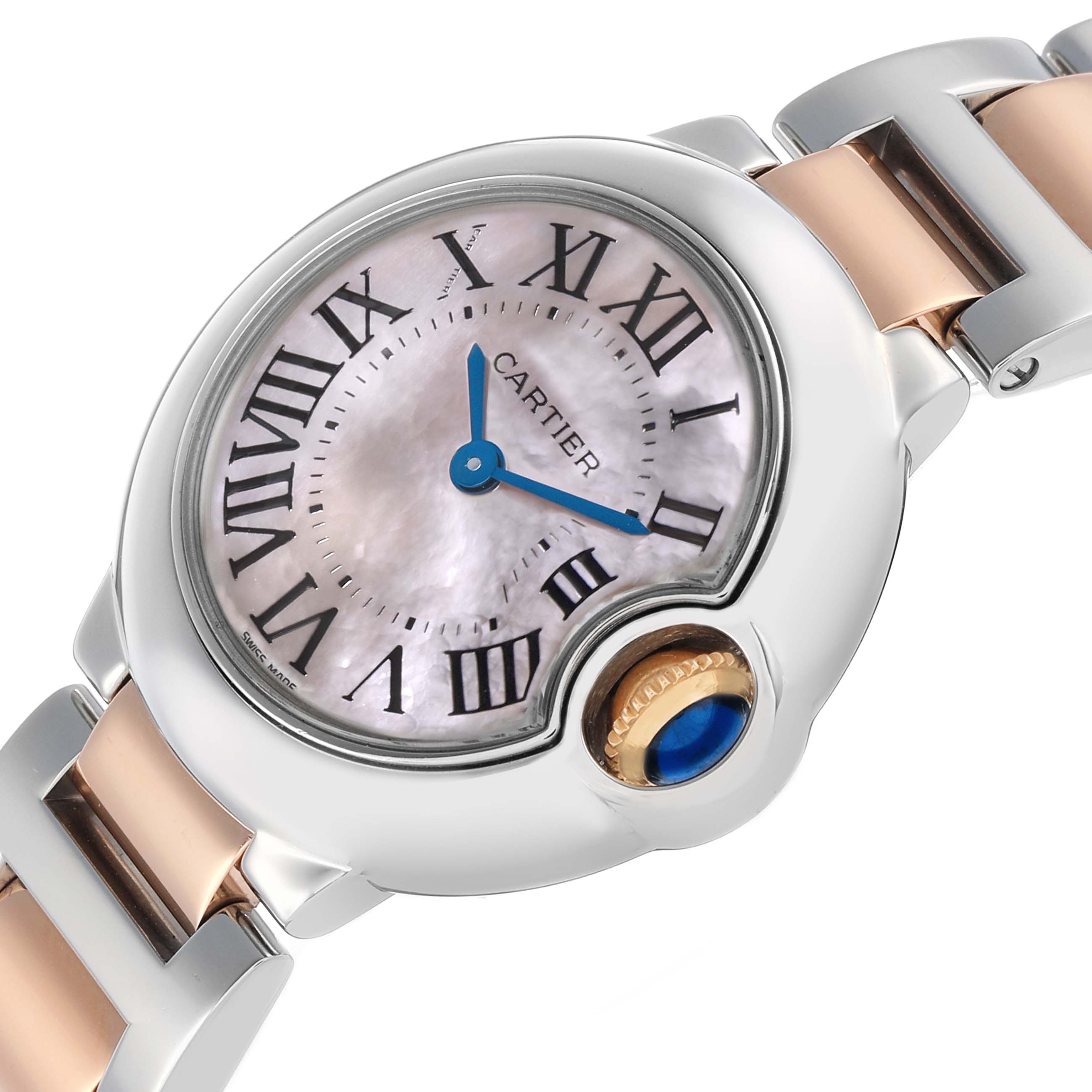 The Ballon Bleu de Cartier watch is shown at an angled close-up, highlighting the dial, crown, and part of the bracelet.