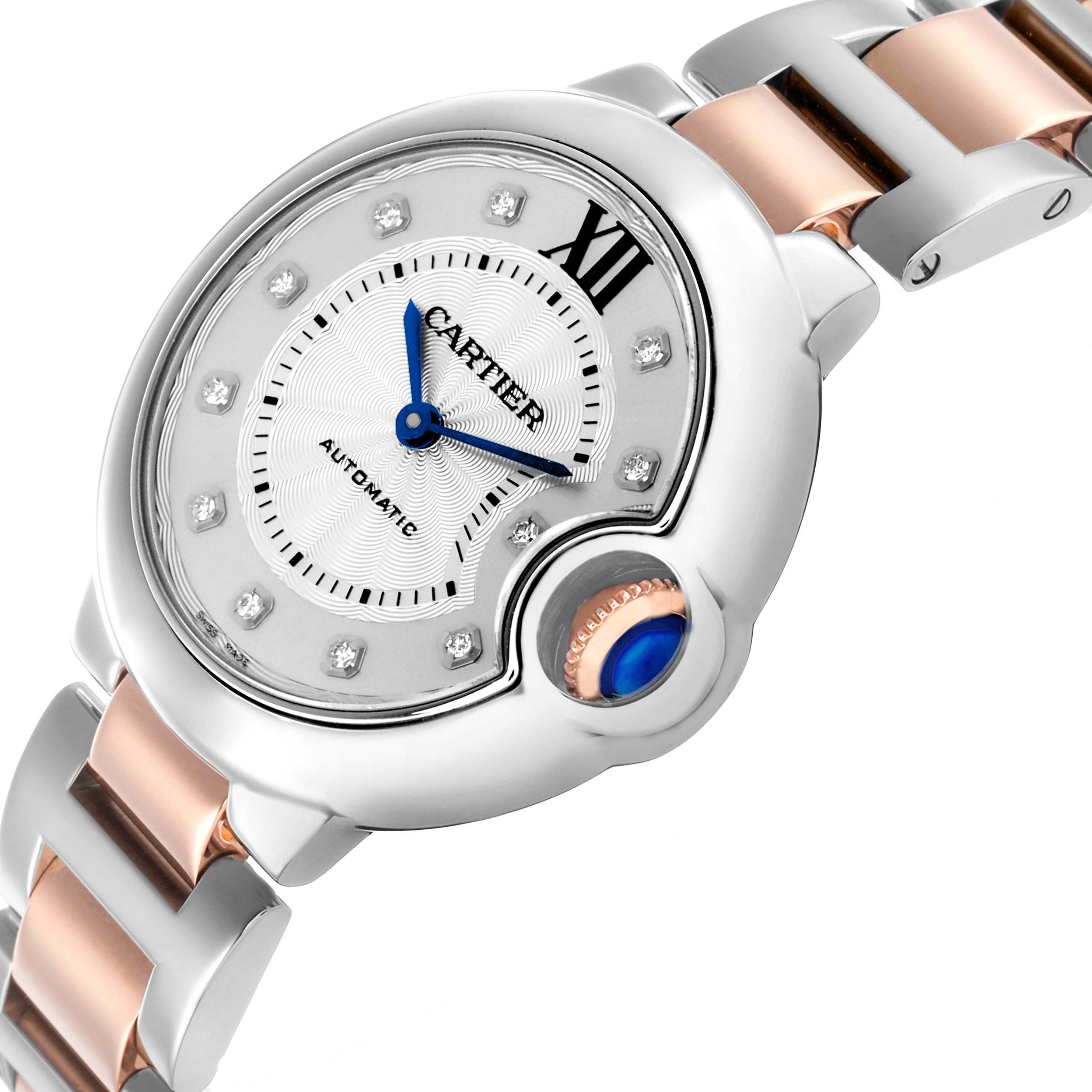 The Cartier Ballon Bleu WE902044 Women's Stainless Steel Silver Dial watch is shown at a slanted angle, highlighting the dial, crown, and two-tone bracelet.