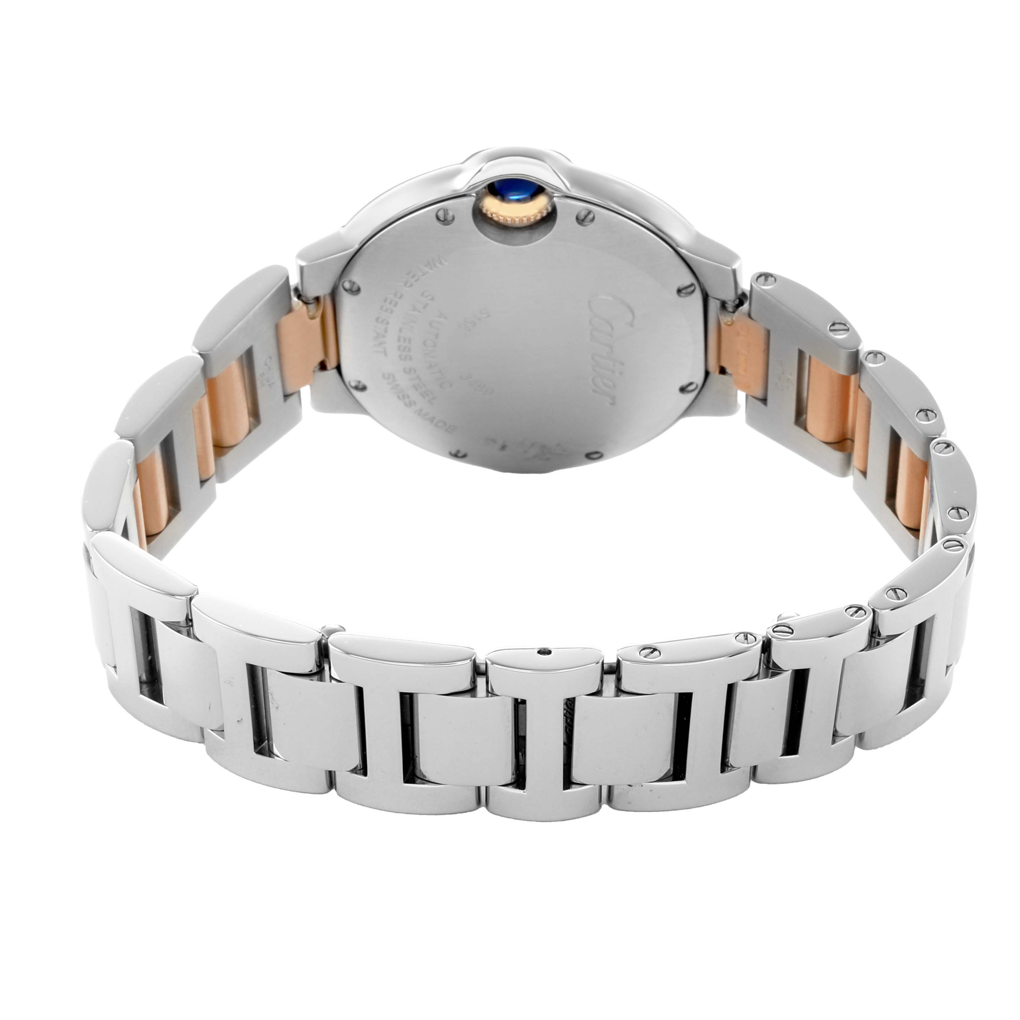 The image shows the back and side of a Ballon Bleu by Cartier, highlighting the bracelet and the caseback.