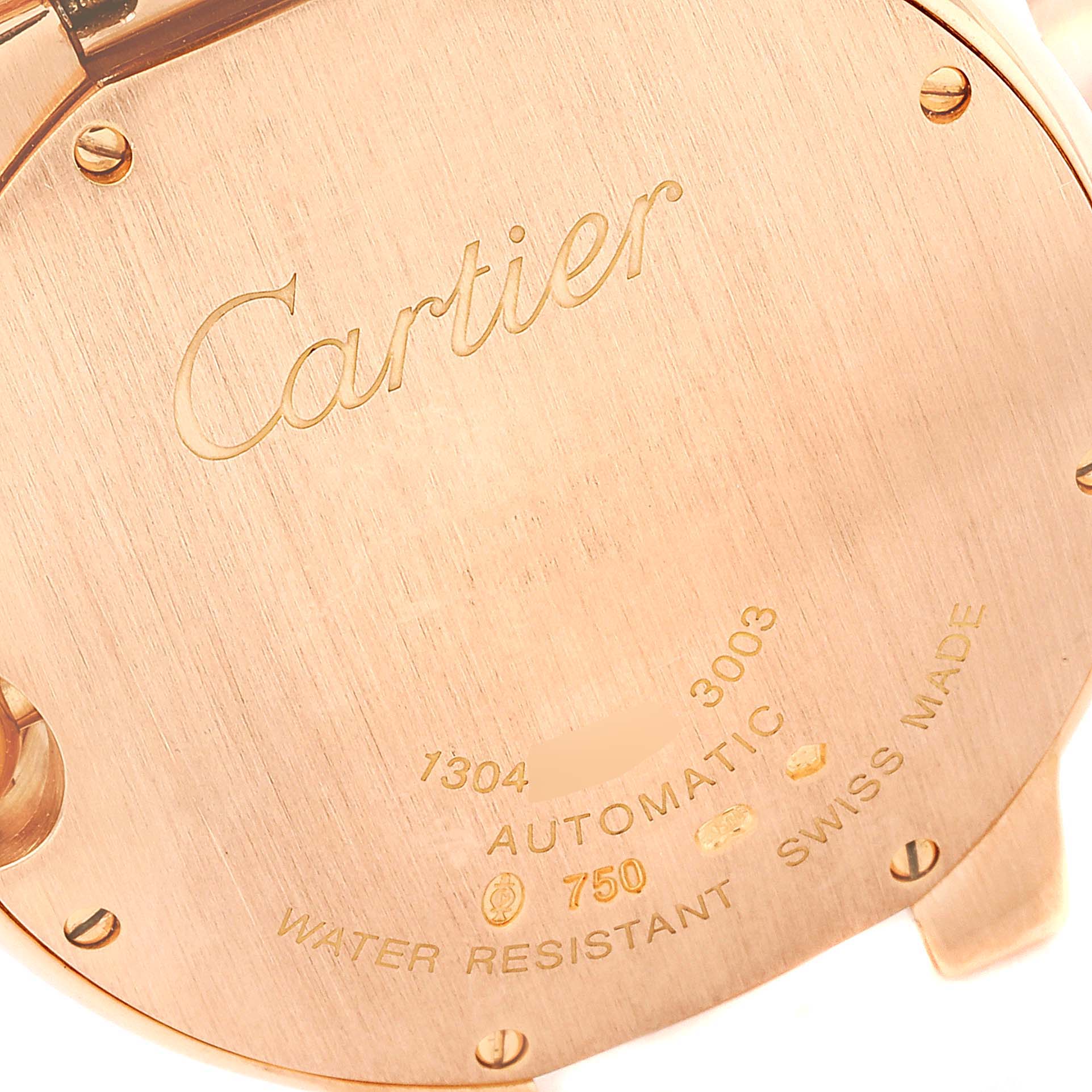The image shows the caseback of the Cartier Ballon Bleu W69004Z2 Men's Rose Gold Silver Dial W69004Z2 Men's Rose Gold Silver Dial watch, displaying engravings and screws.