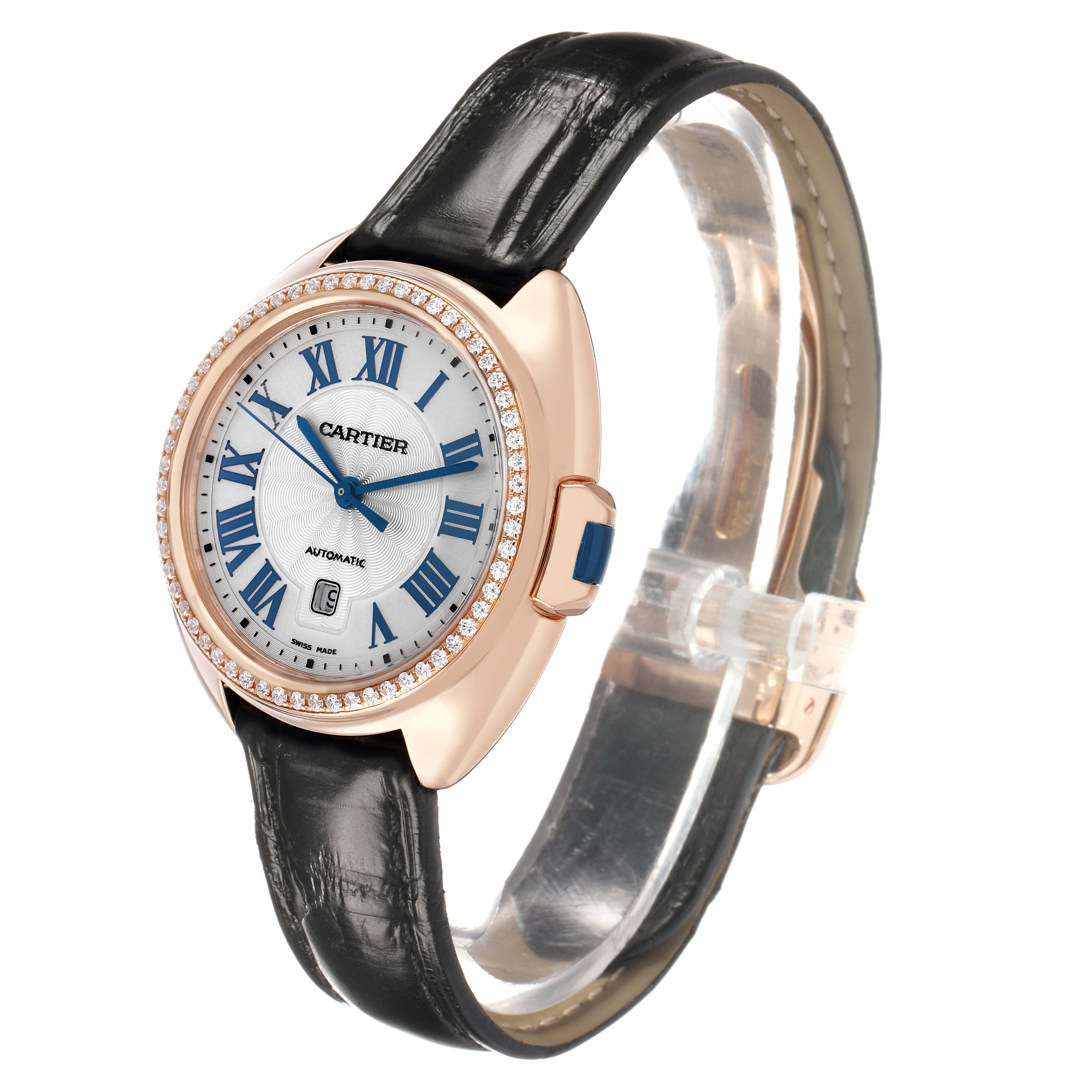 The image shows a Cartier Clé watch at a slight angle, highlighting the face, bezel, and leather strap.